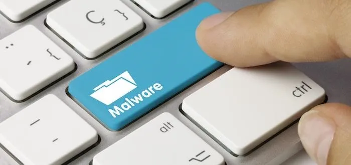Key with "Malware" label on a computer keyboard