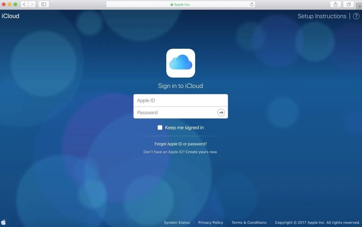 iCloud sign-in page with fields for Apple ID and password.