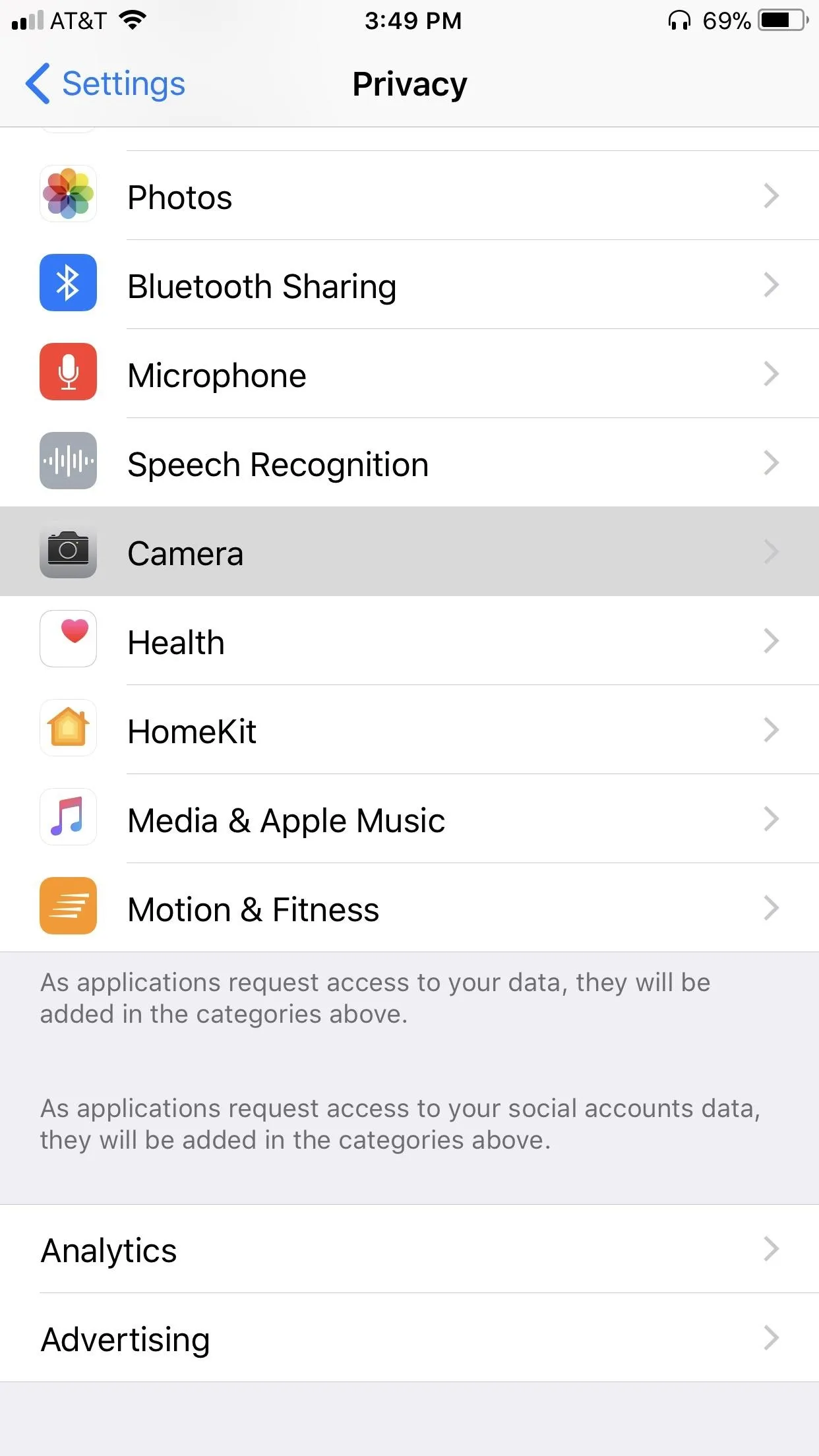 Privacy settings menu on a smartphone, showcasing options like Photos, Microphone, and Contacts.