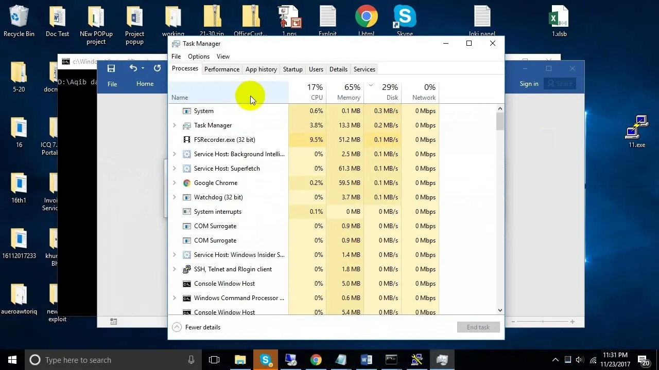 Task Manager displaying system processes and resource usage.