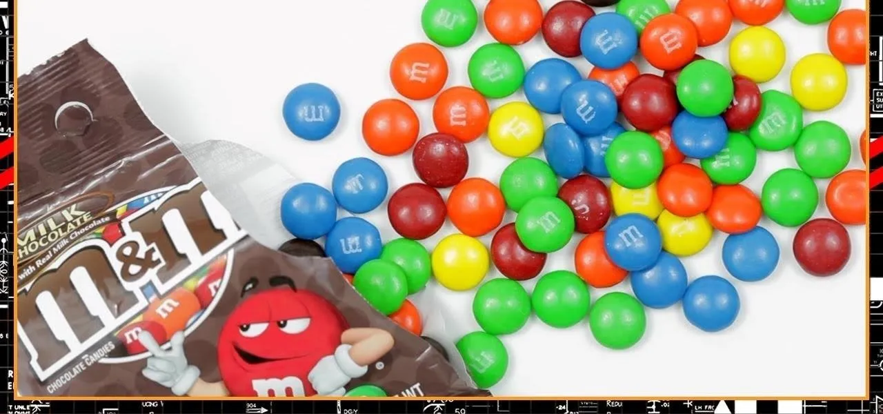 Colorful assortment of M&M's candies spilled from a bag.