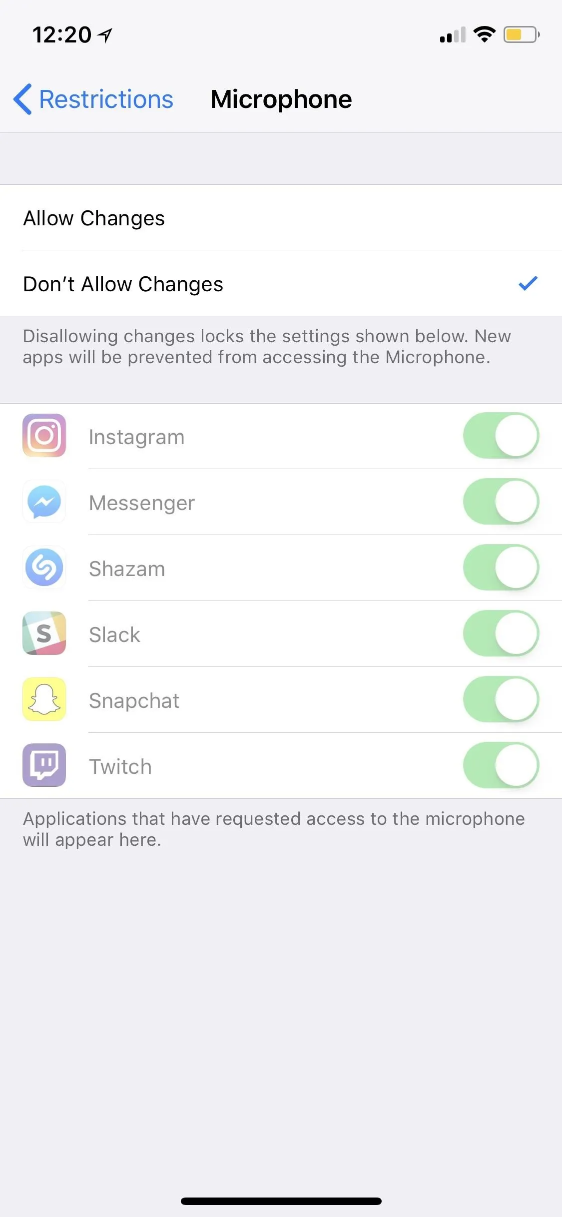 Microphone settings on a mobile device with app permissions.