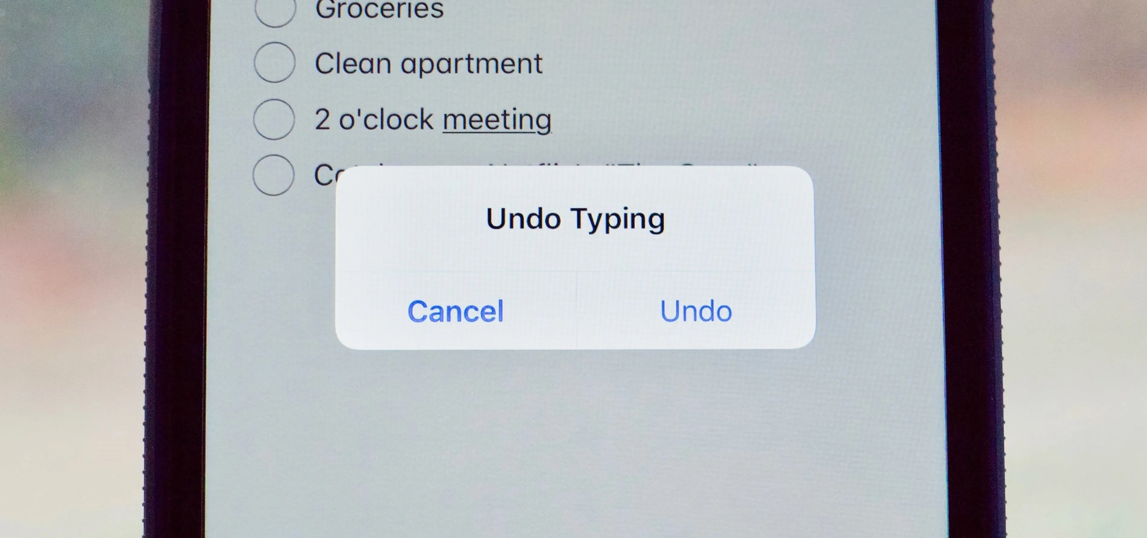 Undo typing confirmation pop-up on a smartphone screen.