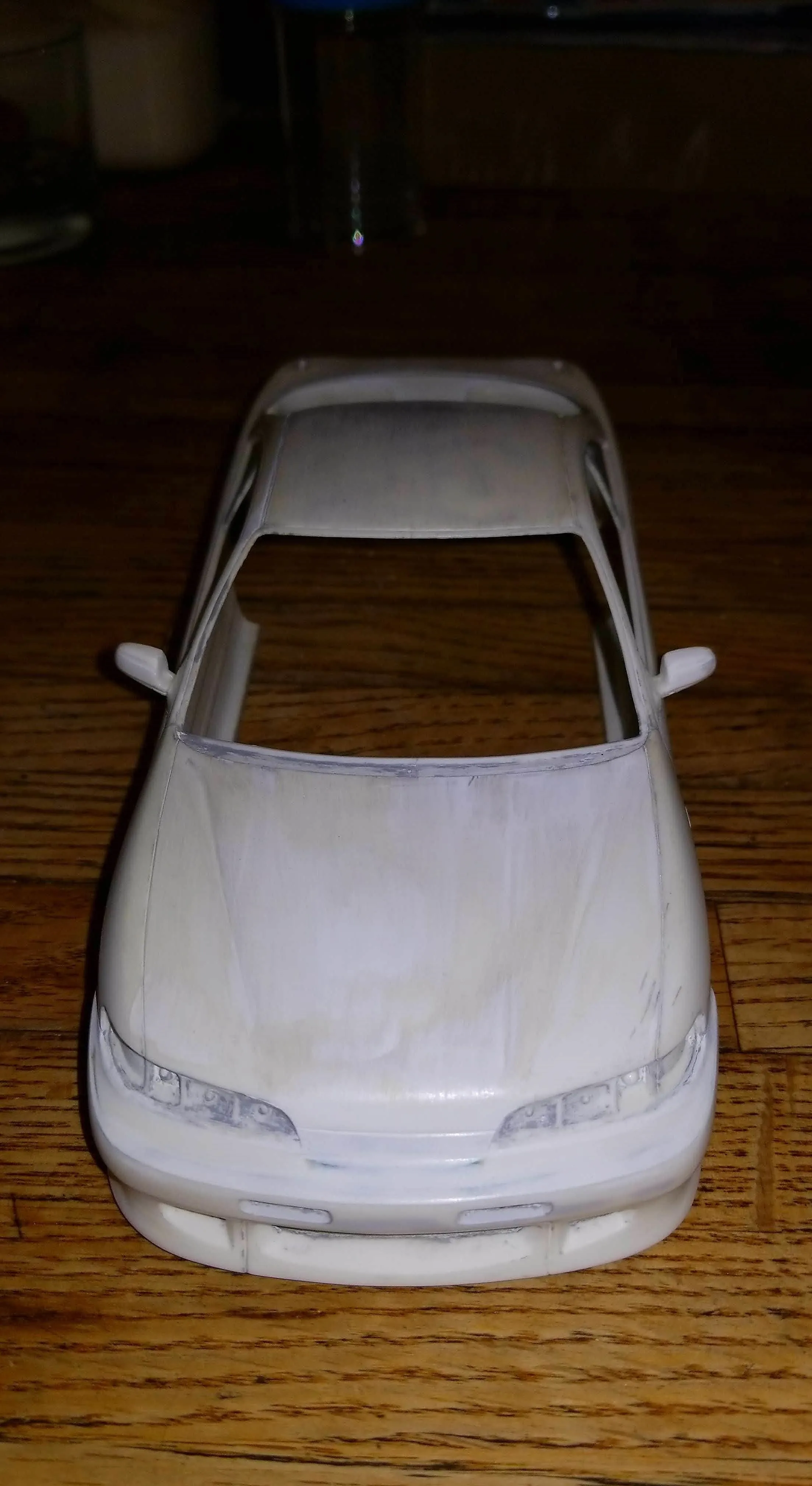 Model car on a wooden surface.