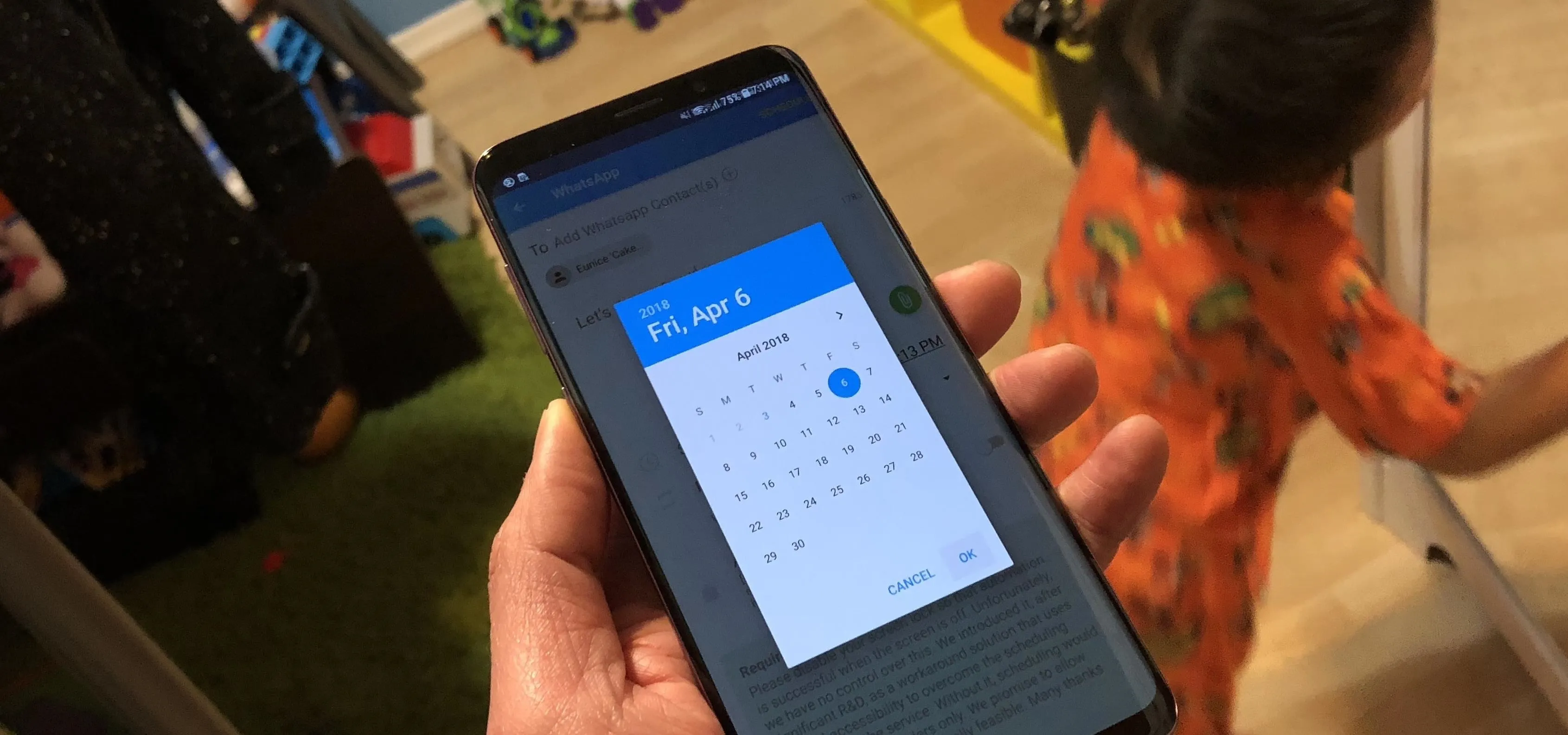 Person using a smartphone to select a date on a calendar app.