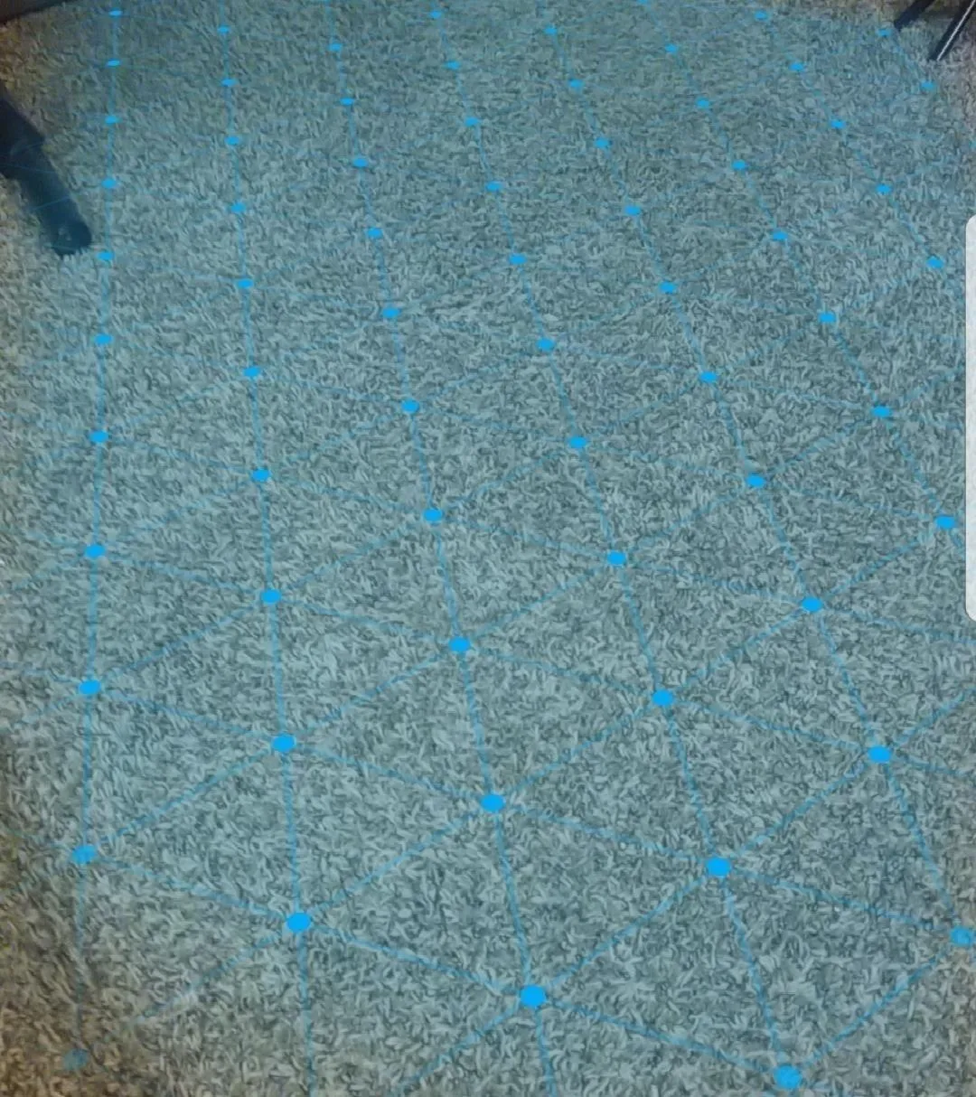 Textured floor with blue spots.