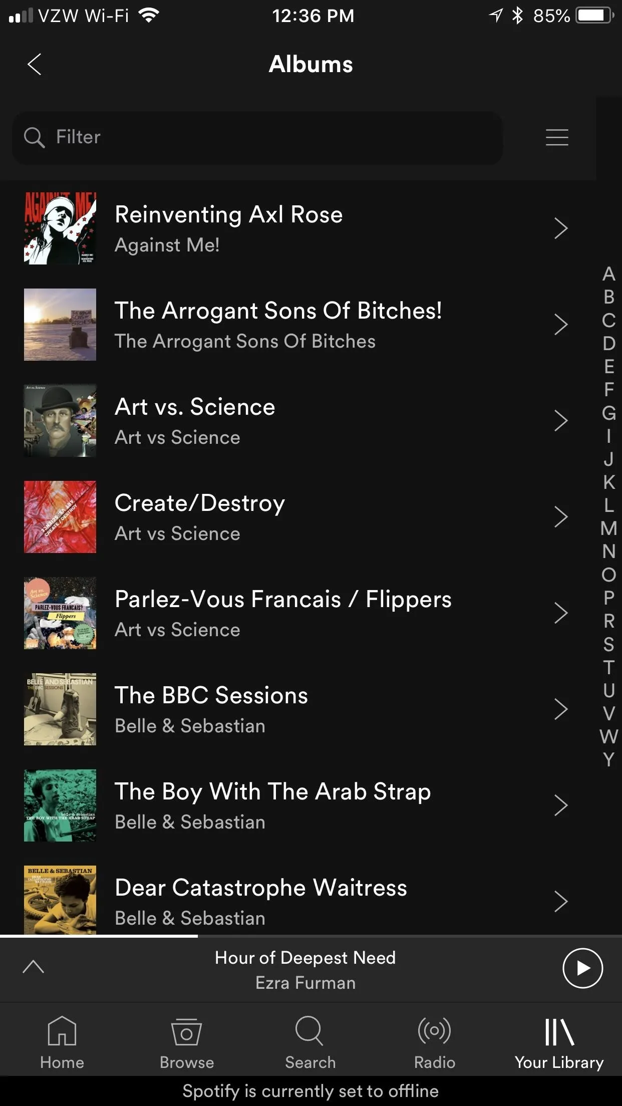 Spotify playlist view featuring various albums and songs.