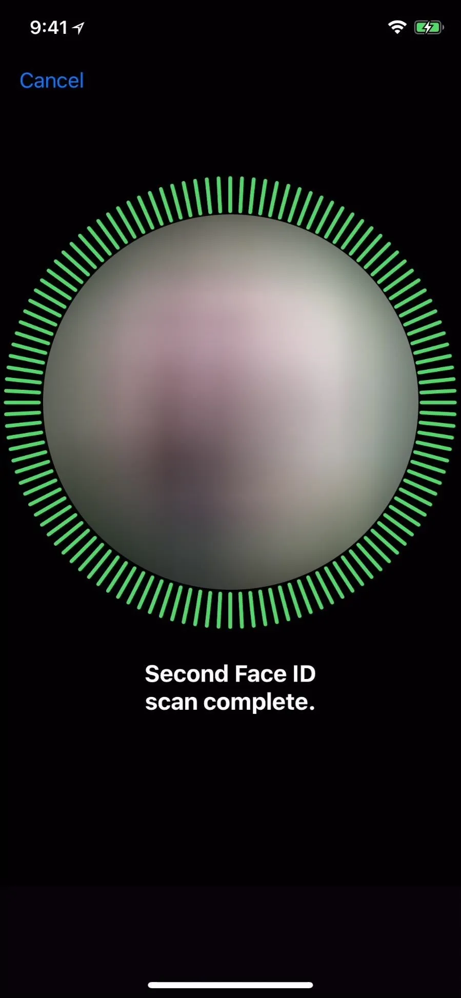 Face scan completed with confirmation circle.