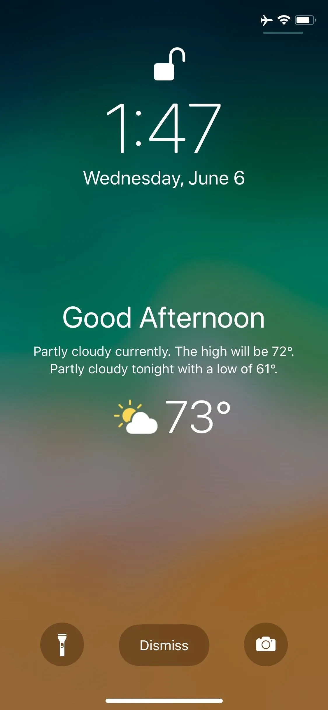 Weather update showing a temperature of 73°F and greeting "Good Afternoon" on a phone lock screen.