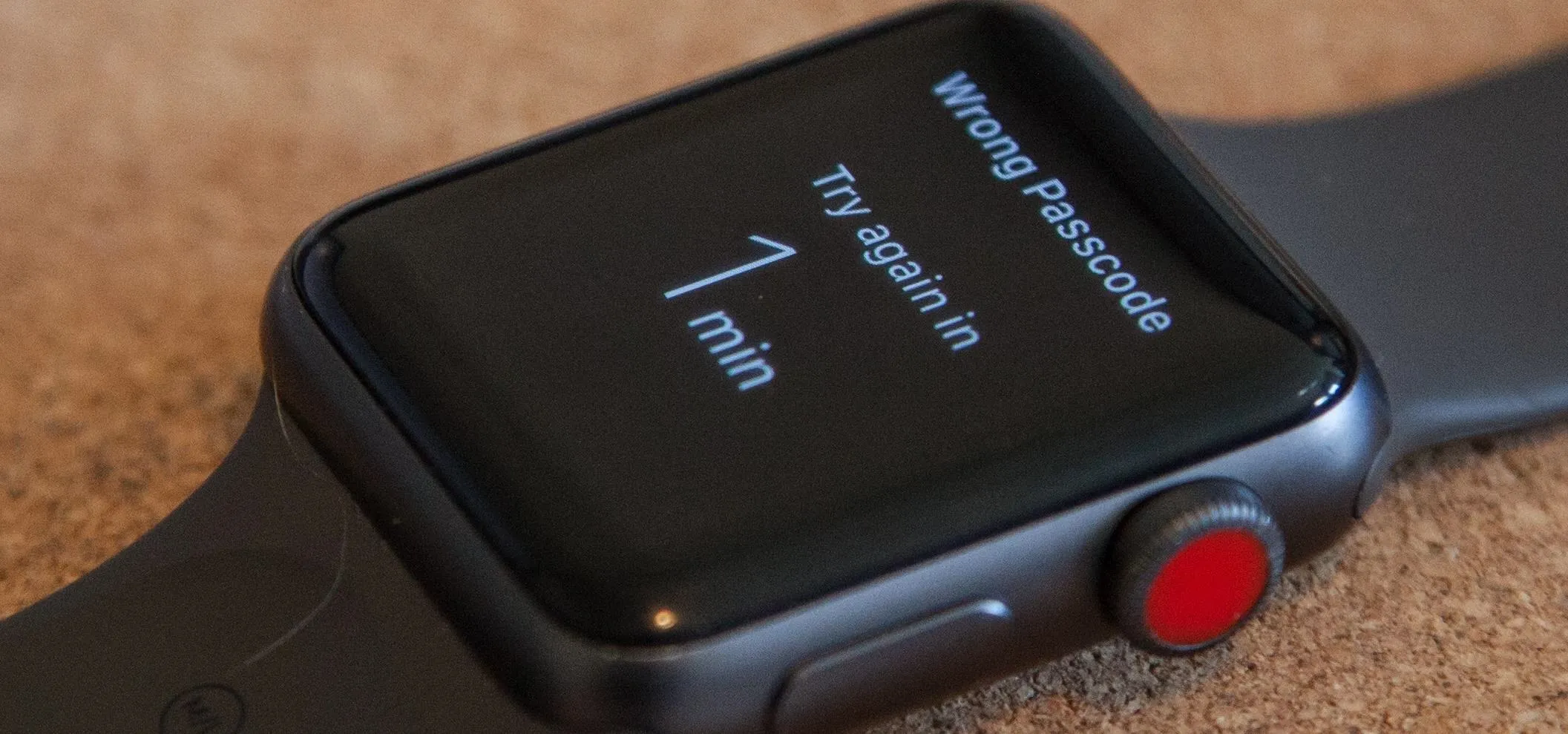 Smartwatch displaying "Wrong Passcode. Try again in 1 min."