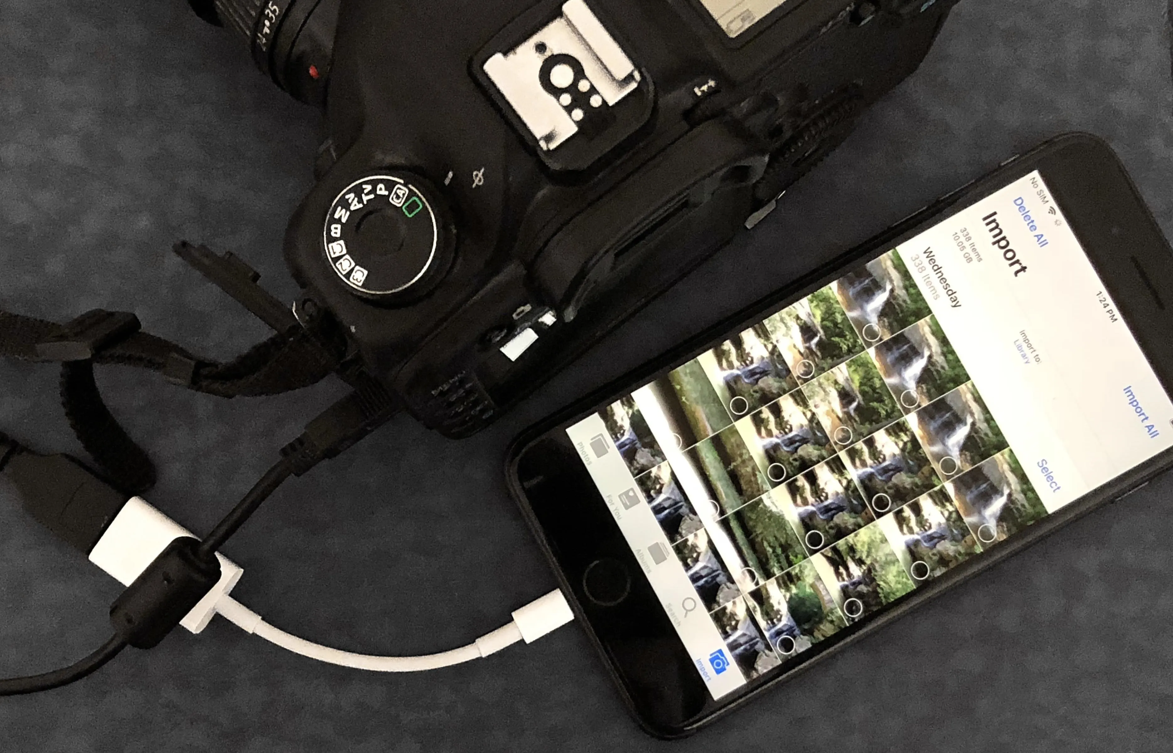 Camera connected to a smartphone displaying images.