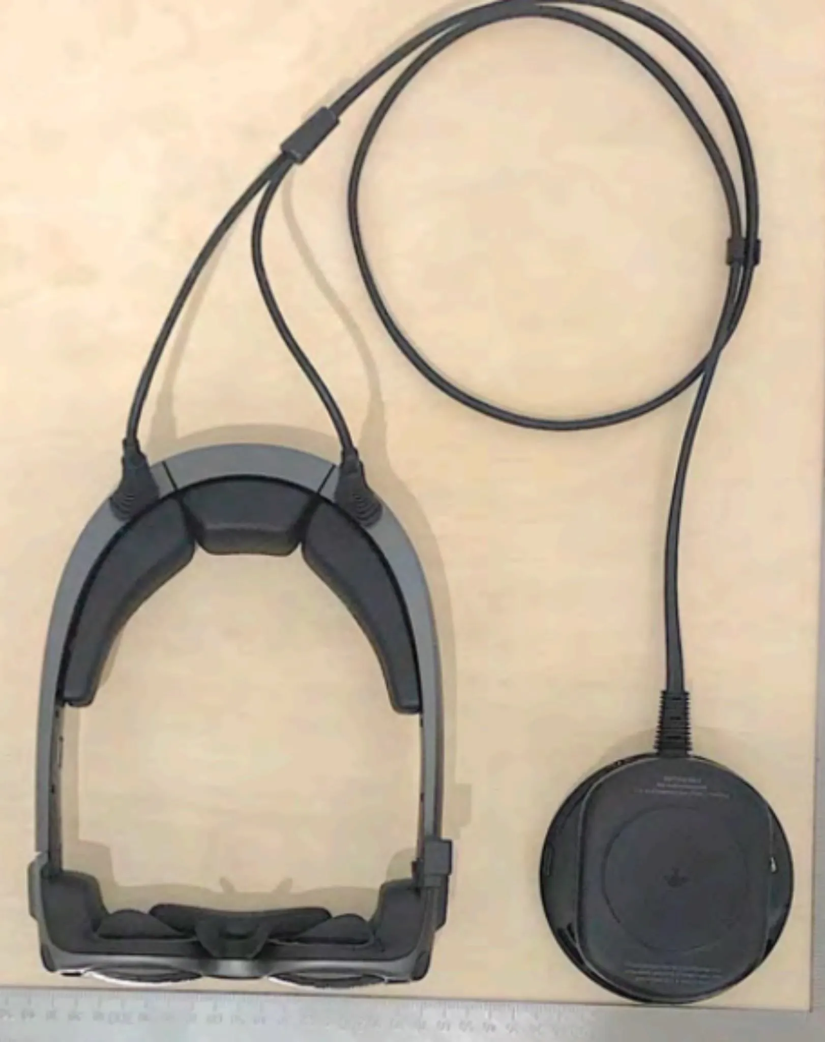 Virtual reality headset with an attached cable.