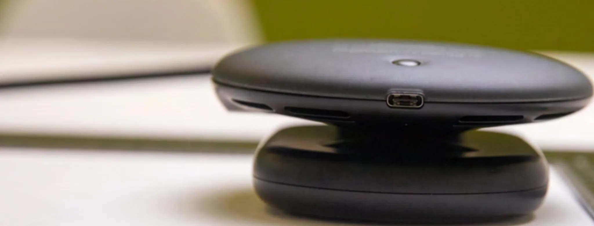 Wireless charging pad on a table.