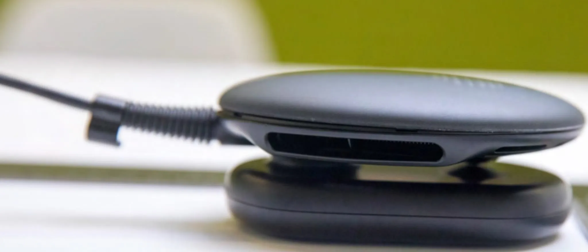 Wireless charging pad on a table.
