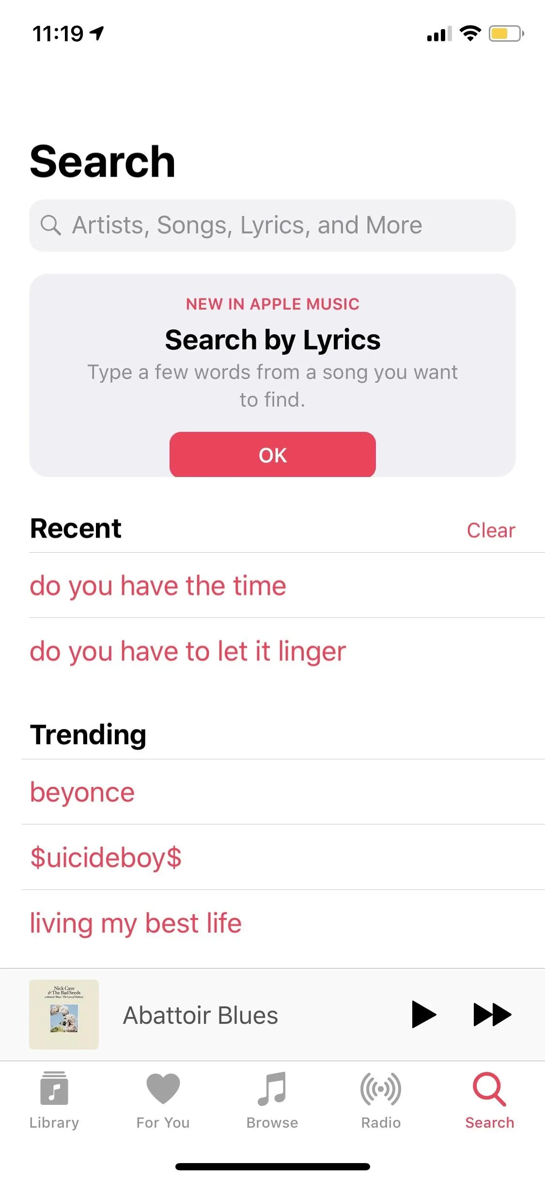 Search interface displaying options for searching by lyrics with trending topics.