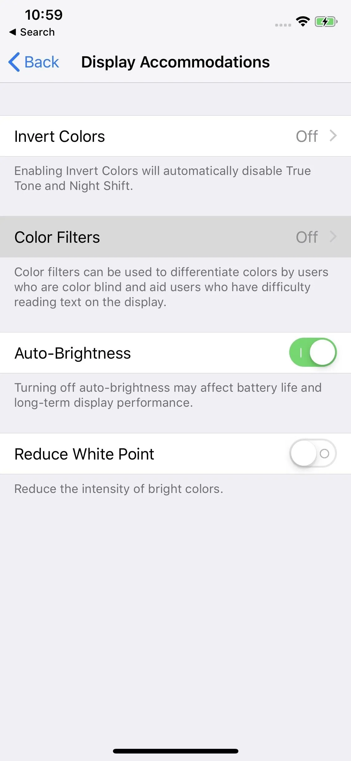 Display settings menu showing options for color filters and brightness adjustments on a smartphone.