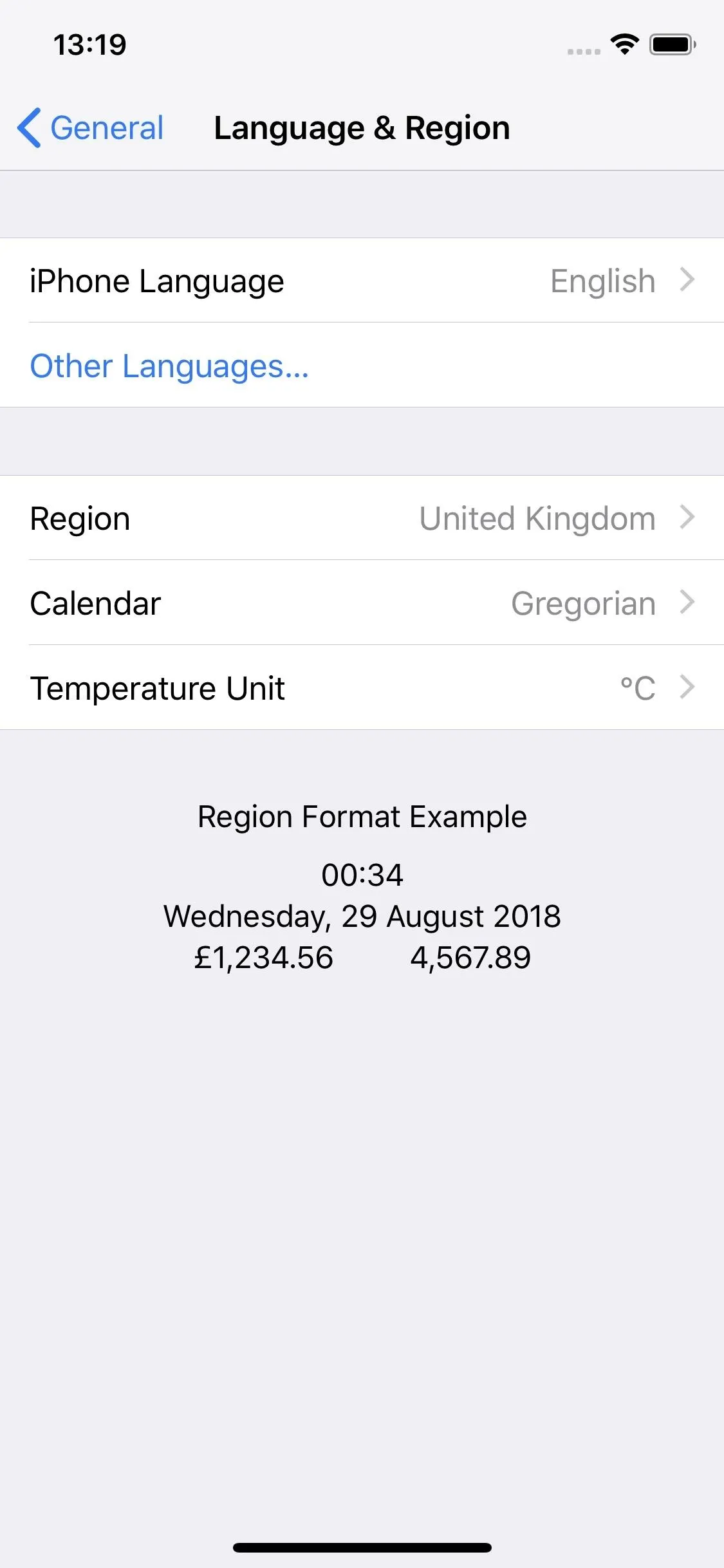 Language and region settings on a mobile device displaying options for language, region, and temperature unit.