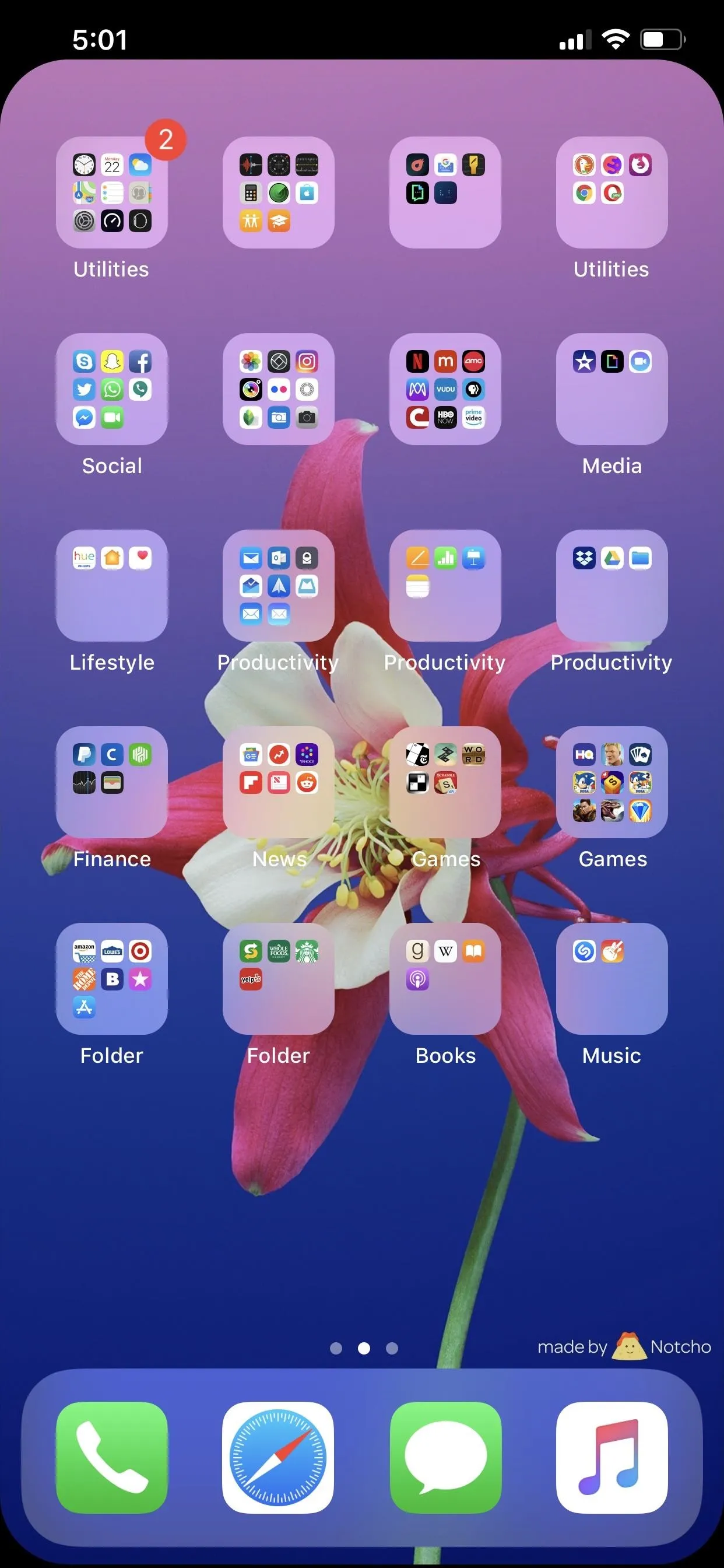 Smartphone screen with app icons arranged on a floral background.