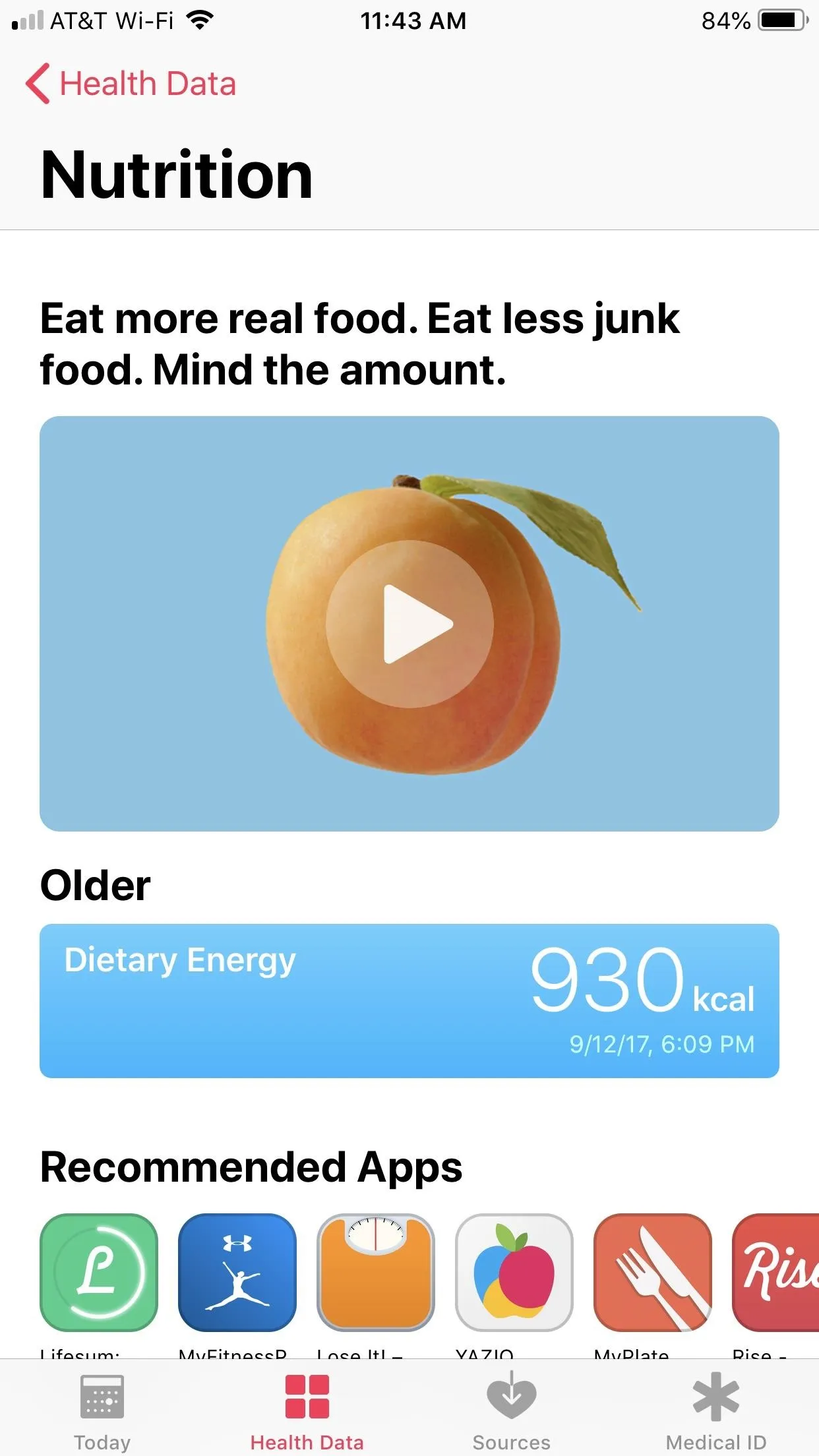 A smartphone screen displaying nutrition advice with an orange fruit and a play button.