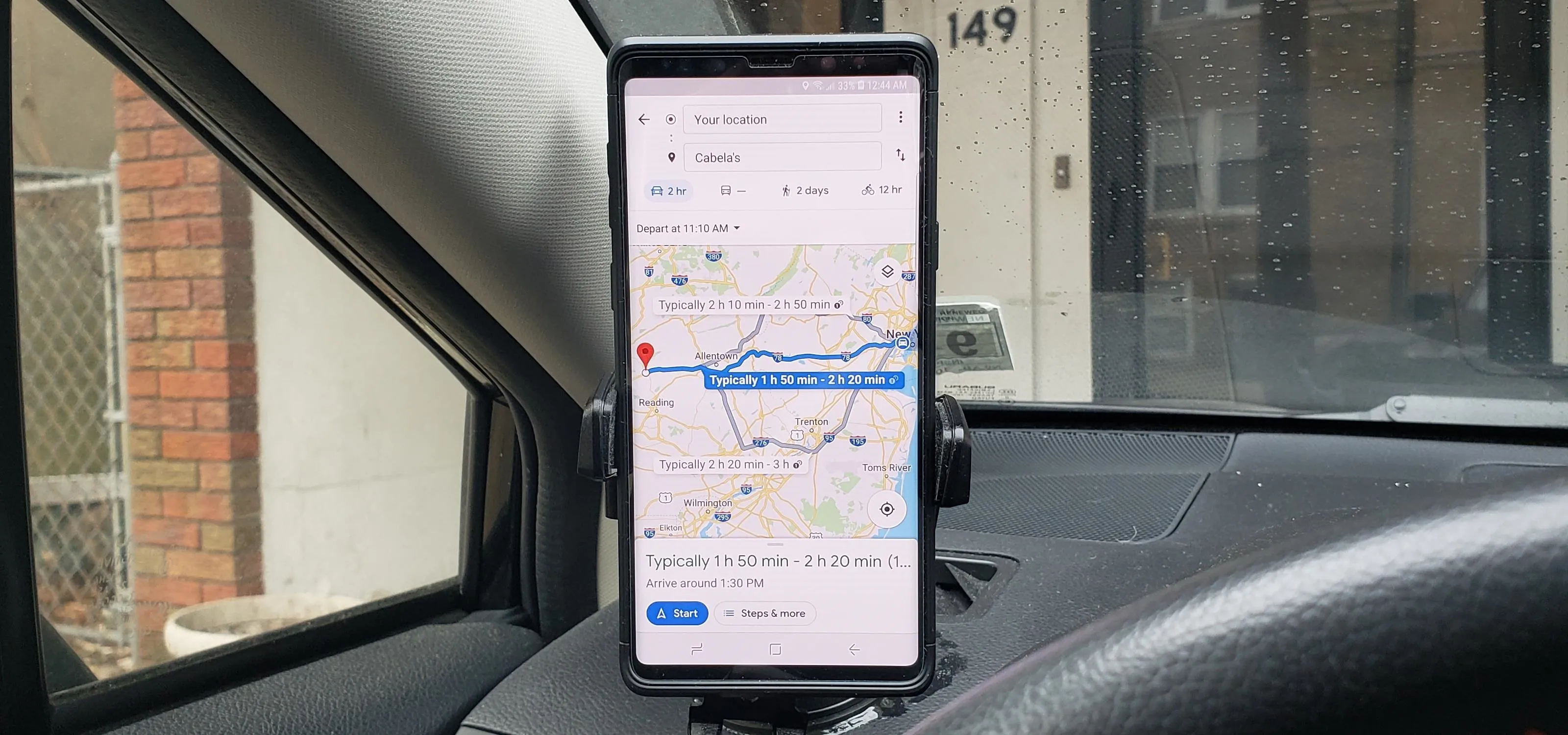 Navigation map displayed on a smartphone mounted in a car.