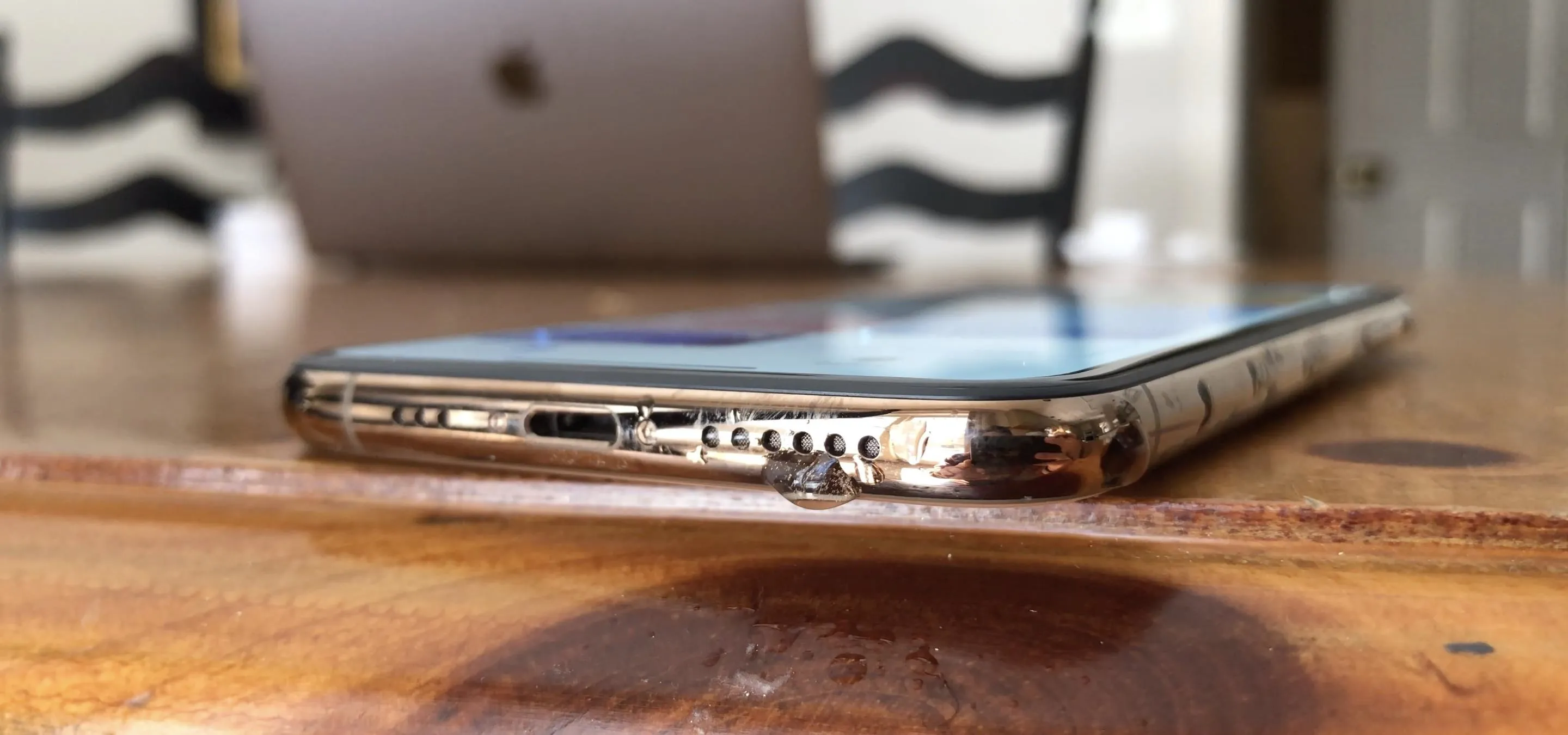 Smartphone lying on a wooden table.