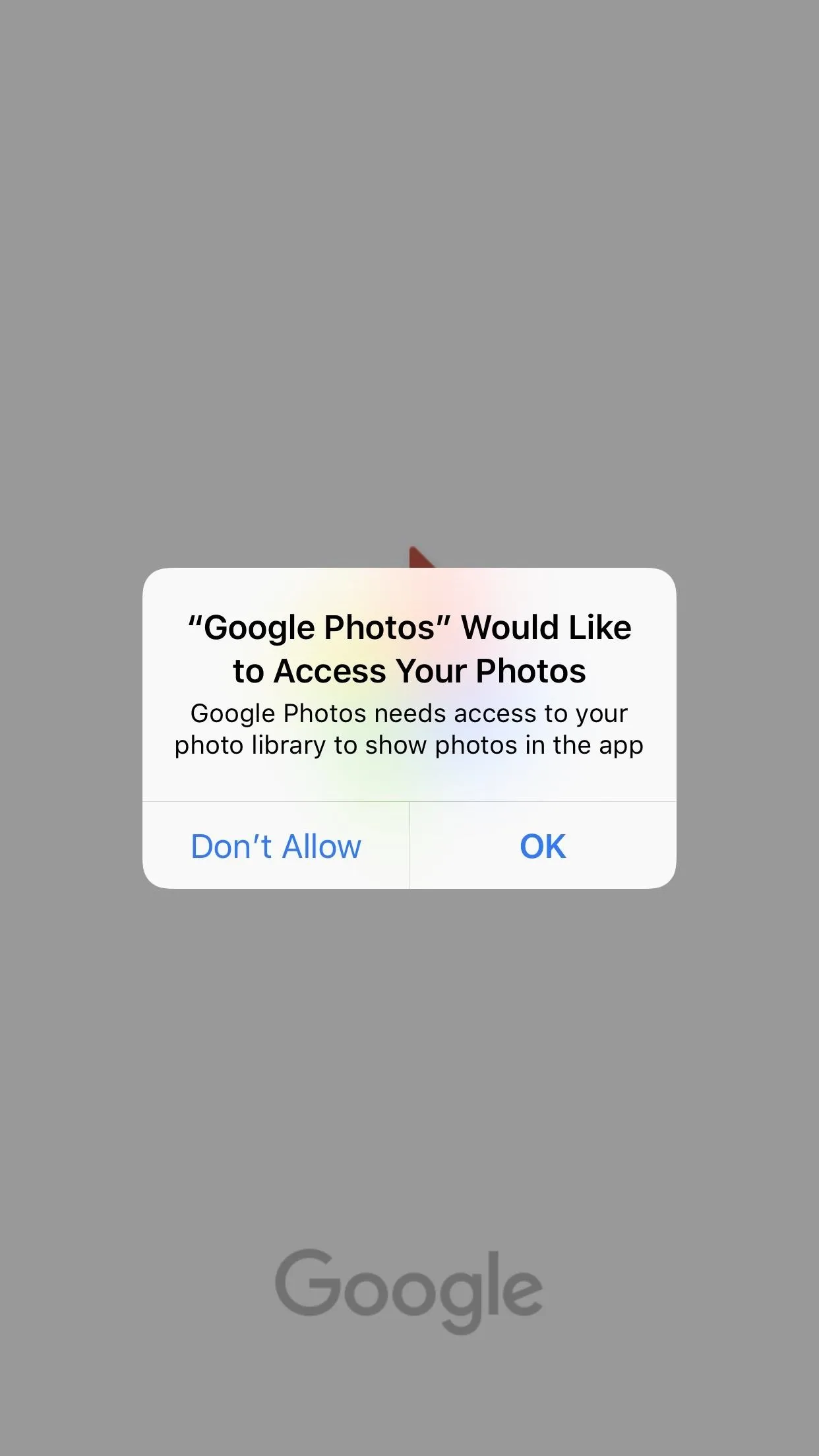 Google Photos permission request pop-up on a smartphone.