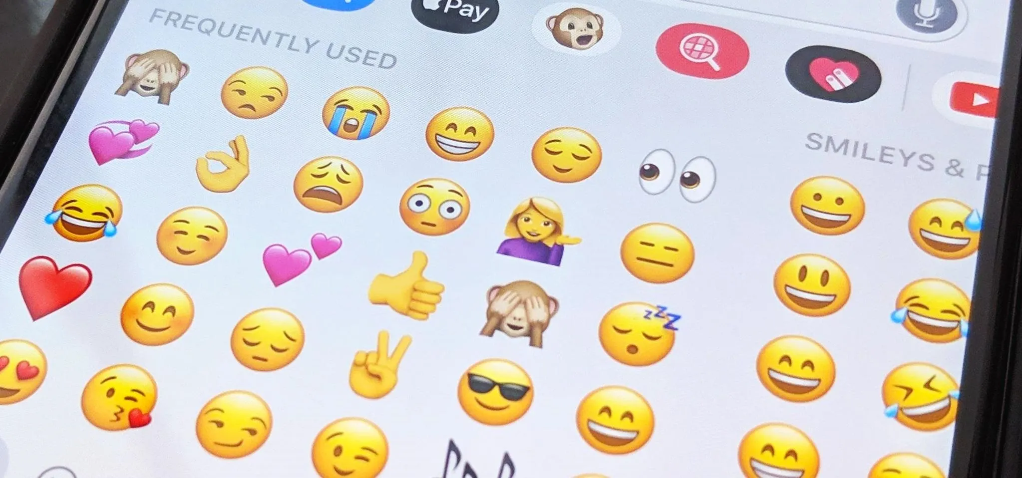 A smartphone screen displaying a variety of emojis.