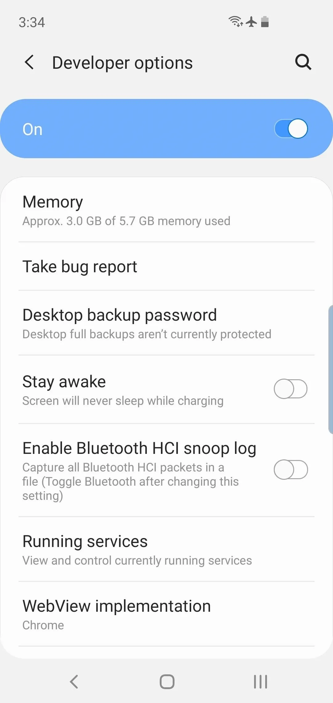 Developer options menu on a smartphone displaying various settings like memory usage, backup password, and Bluetooth options.