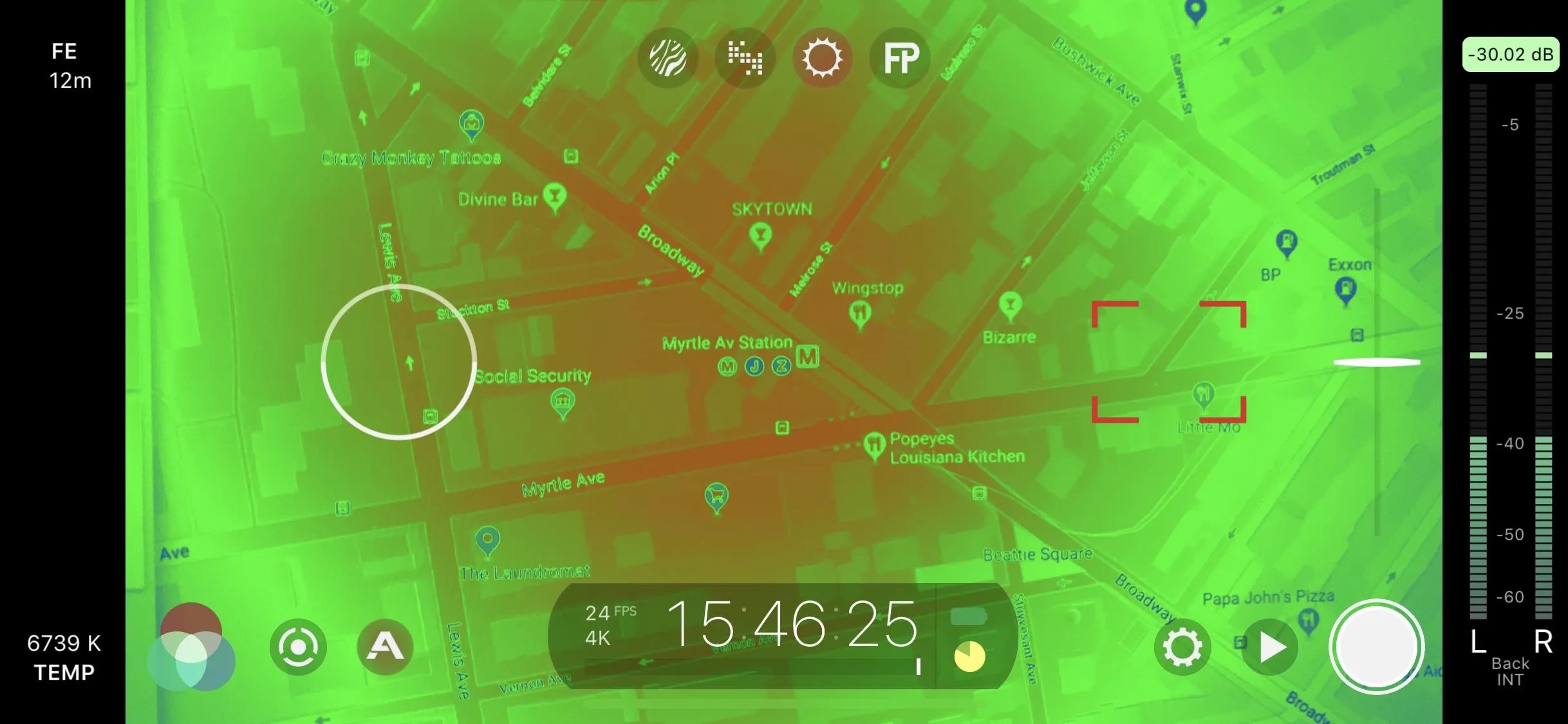 Aerial view of a city map overlaid with a thermal imaging filter.