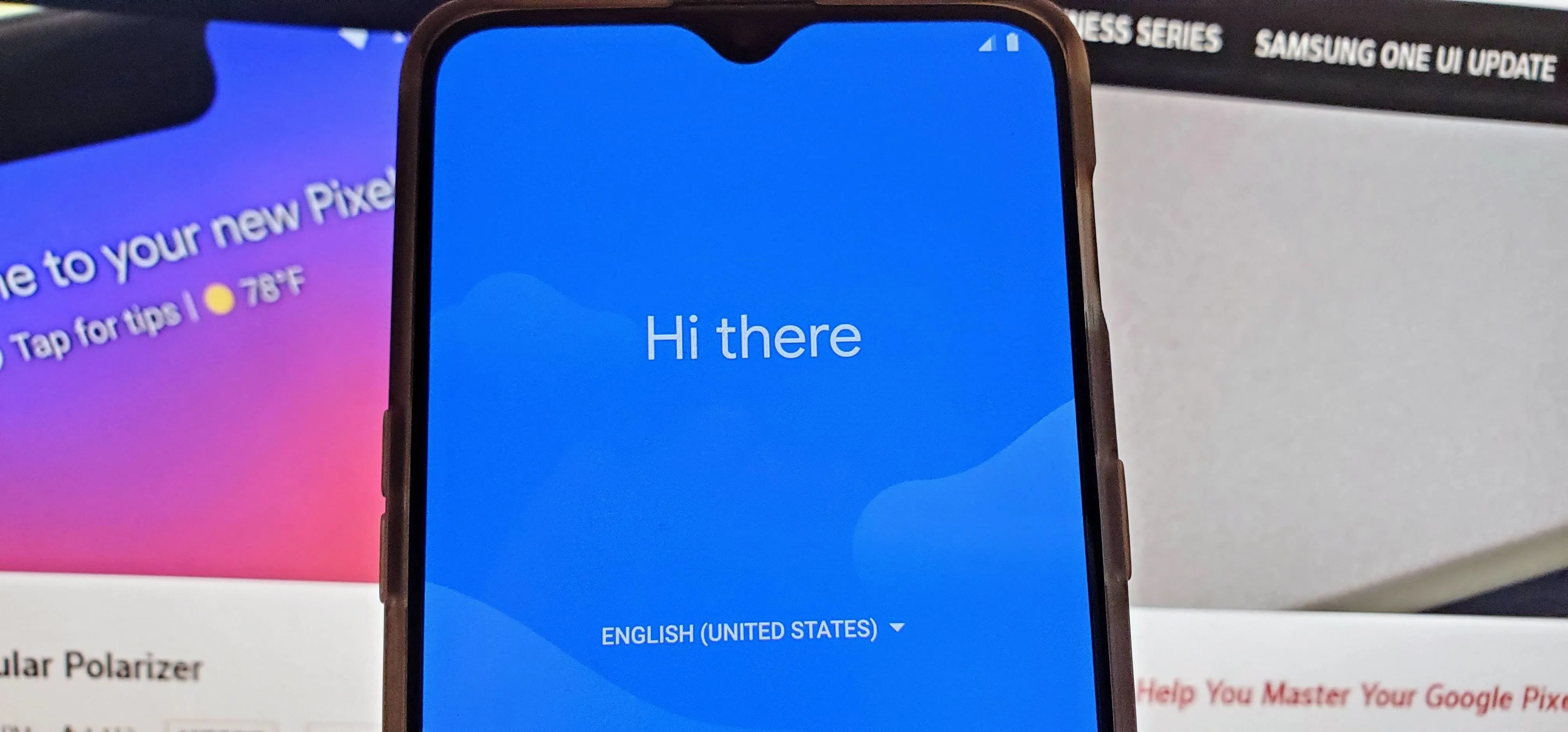 Smartphone displaying a welcome message on a blue screen.