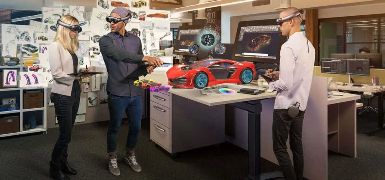 Professionals using augmented reality technology to design a car prototype in a modern workspace.