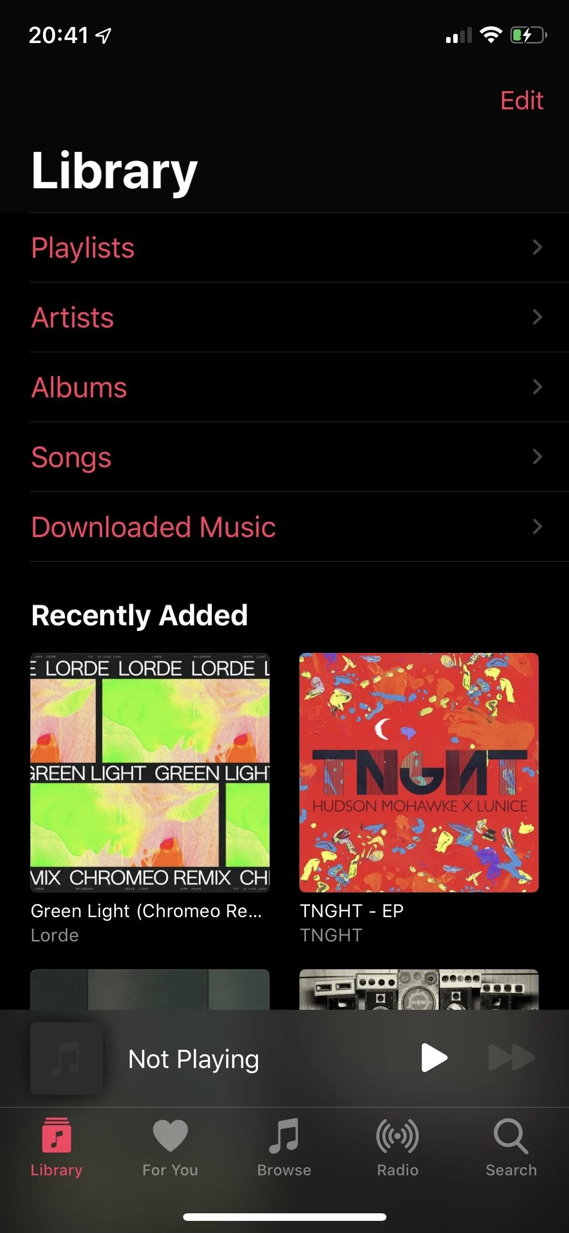 Music library interface displaying playlists and recently added songs.