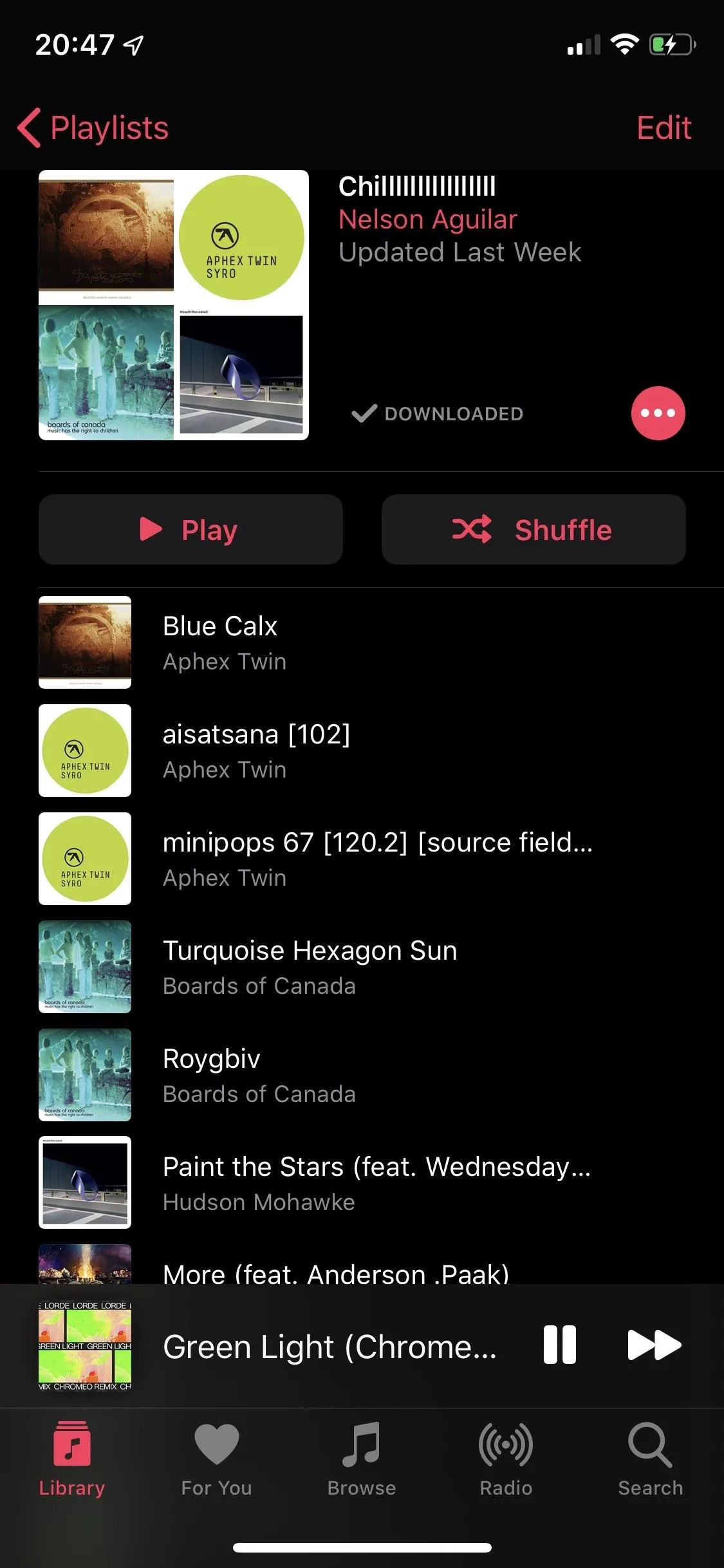 Music player interface displaying various tracks and playlists.