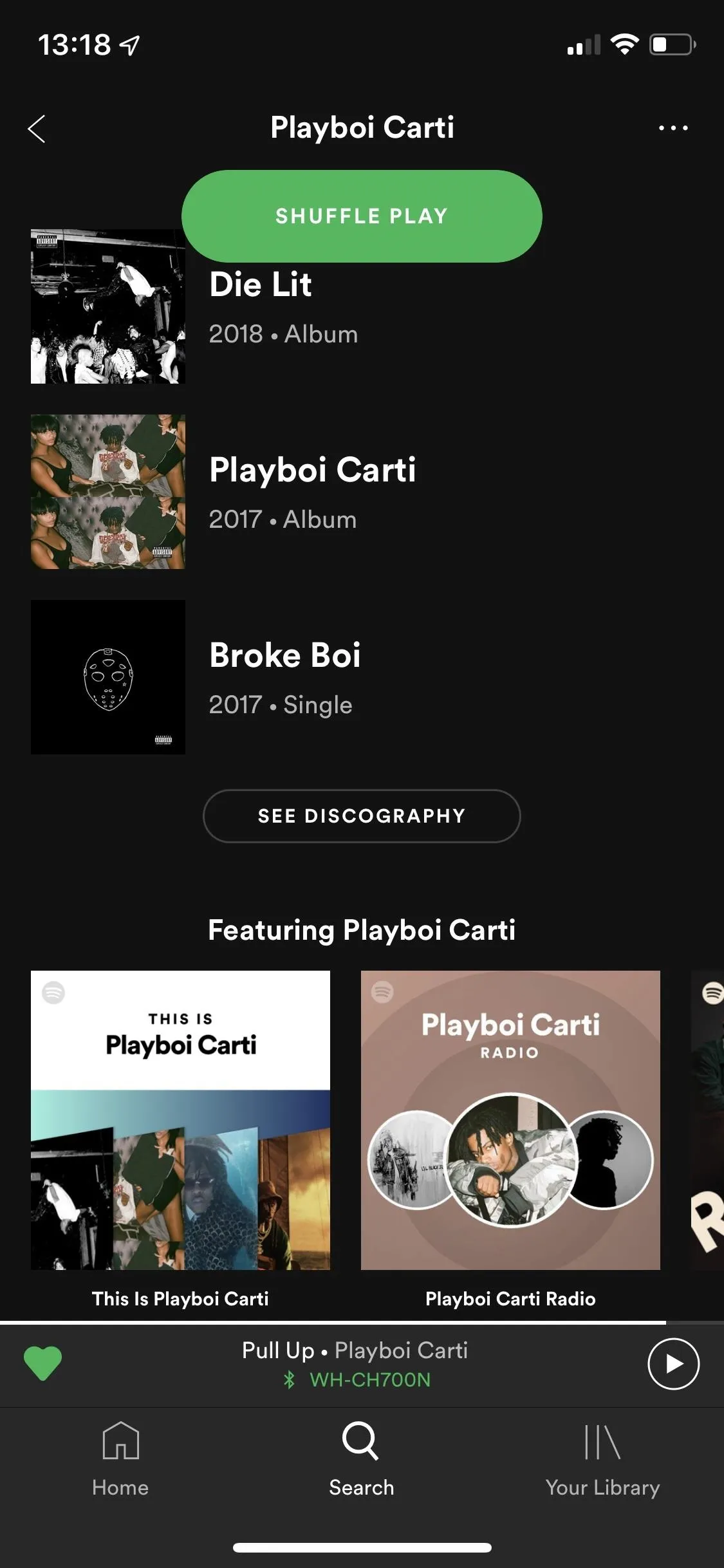 Playlist on Spotify featuring various tracks including "Playboi Carti."