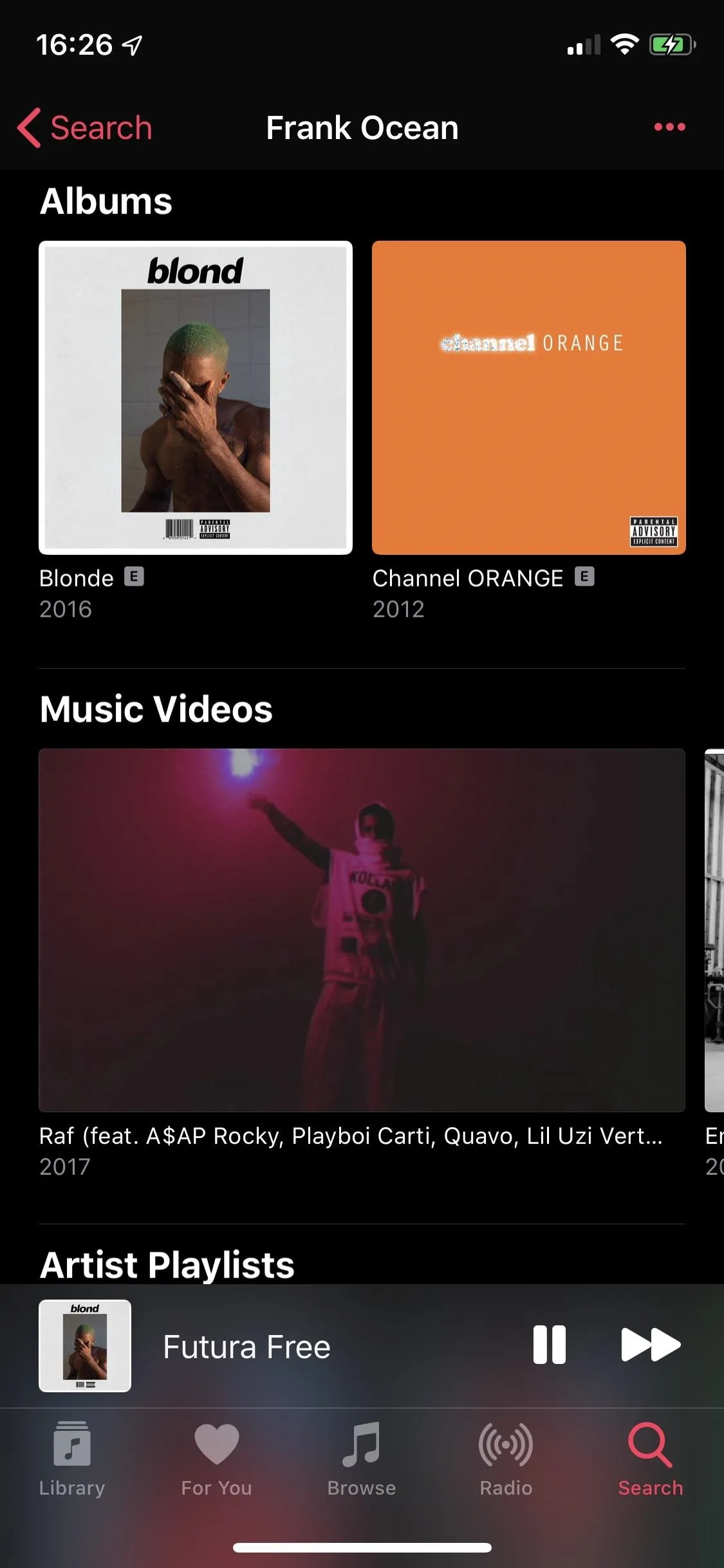 Music app interface showcasing albums and music videos.