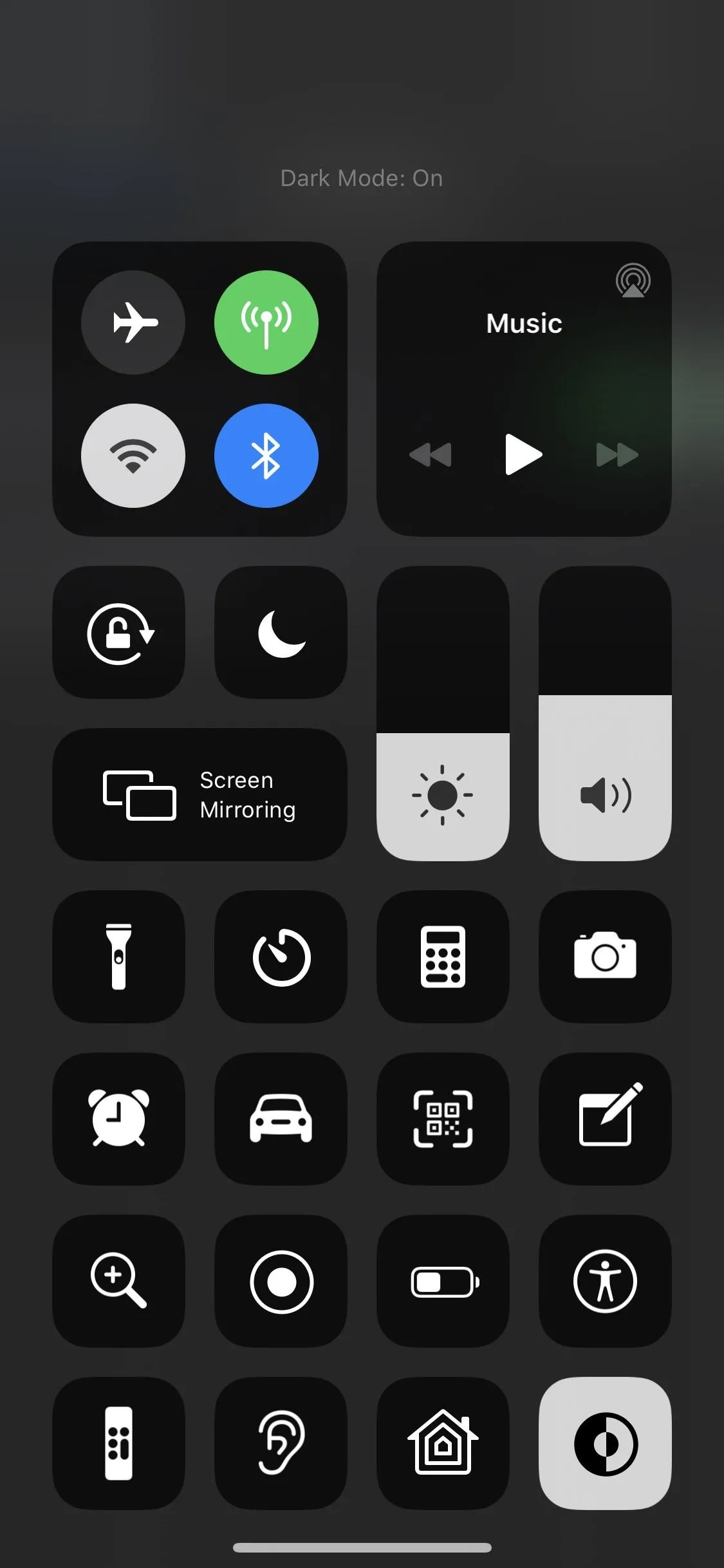 Control center interface showing various shortcut icons and settings options.