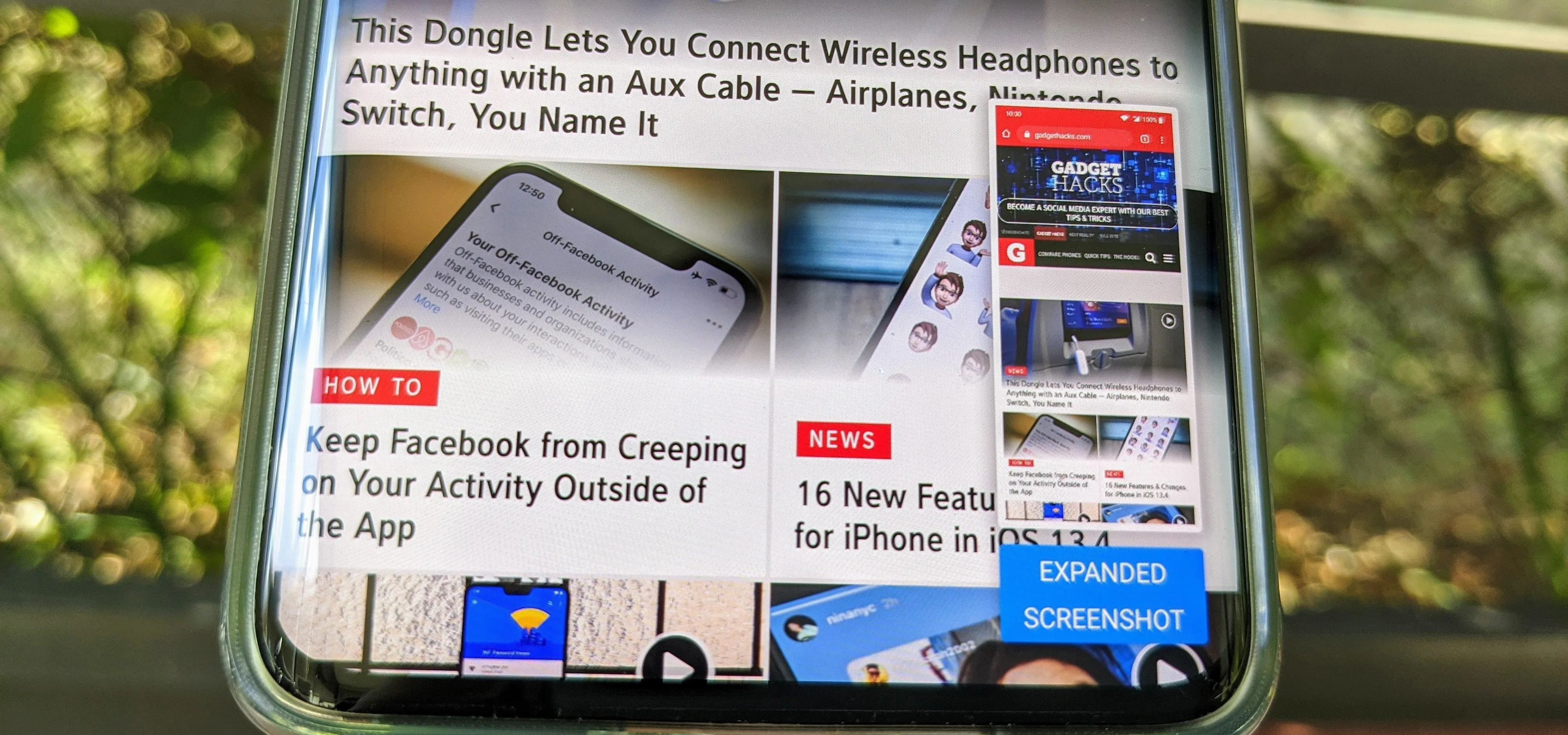 Smartphone displaying articles about wireless headphones and social media features.