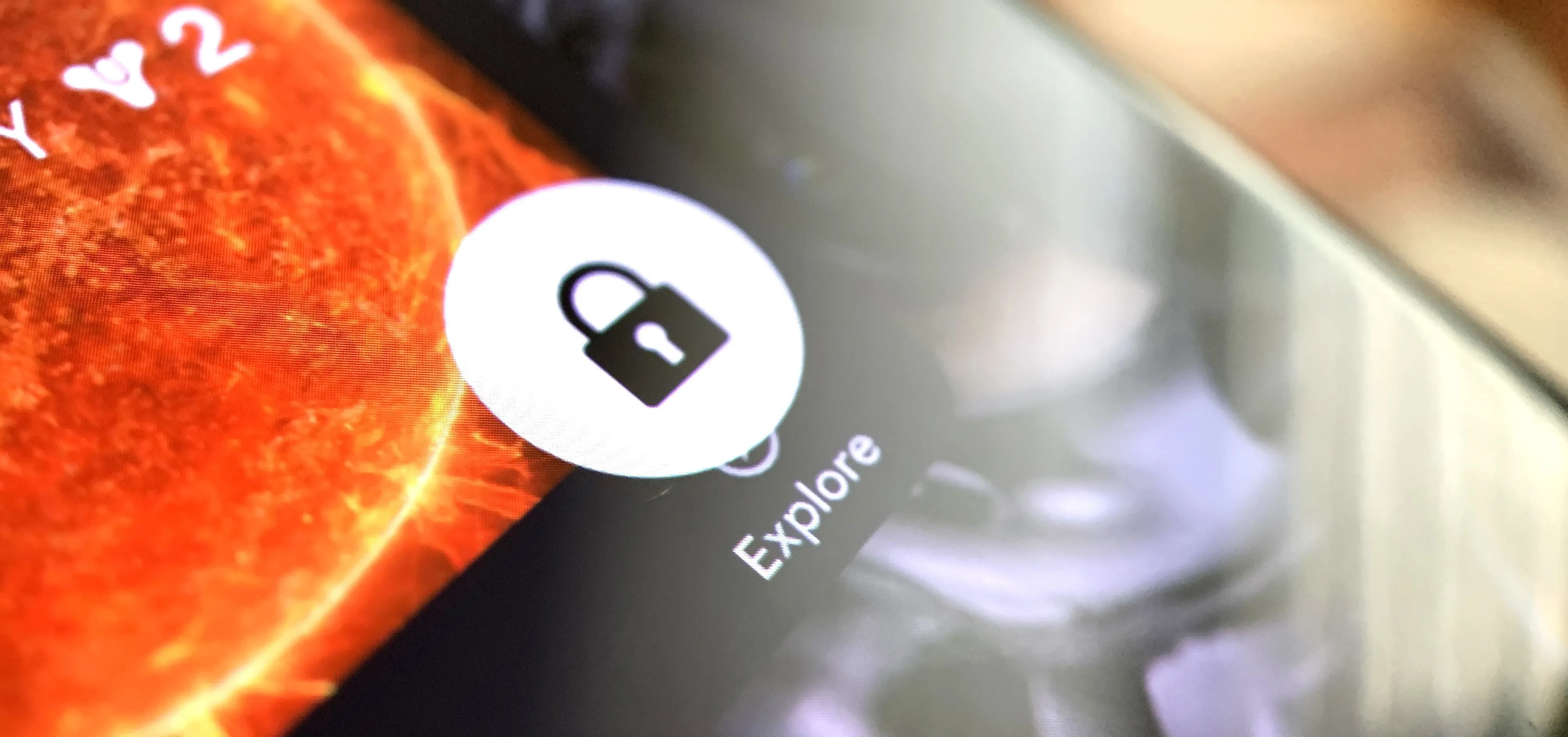 Explore icon with padlock on a smartphone screen.