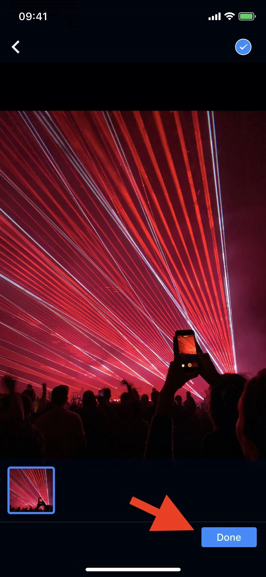 Laser light show with audience silhouettes.