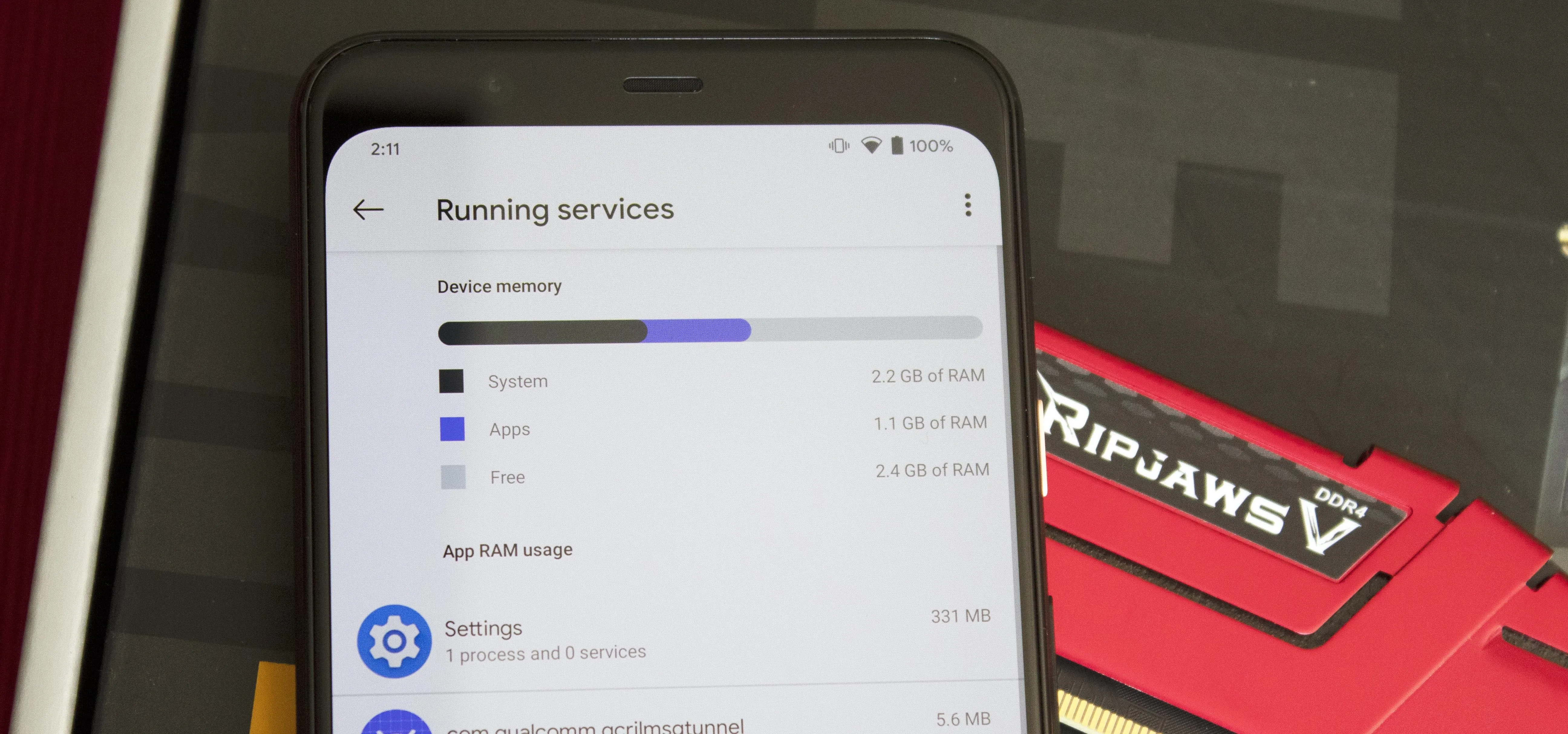 Smartphone screen displaying running services and performance metrics.