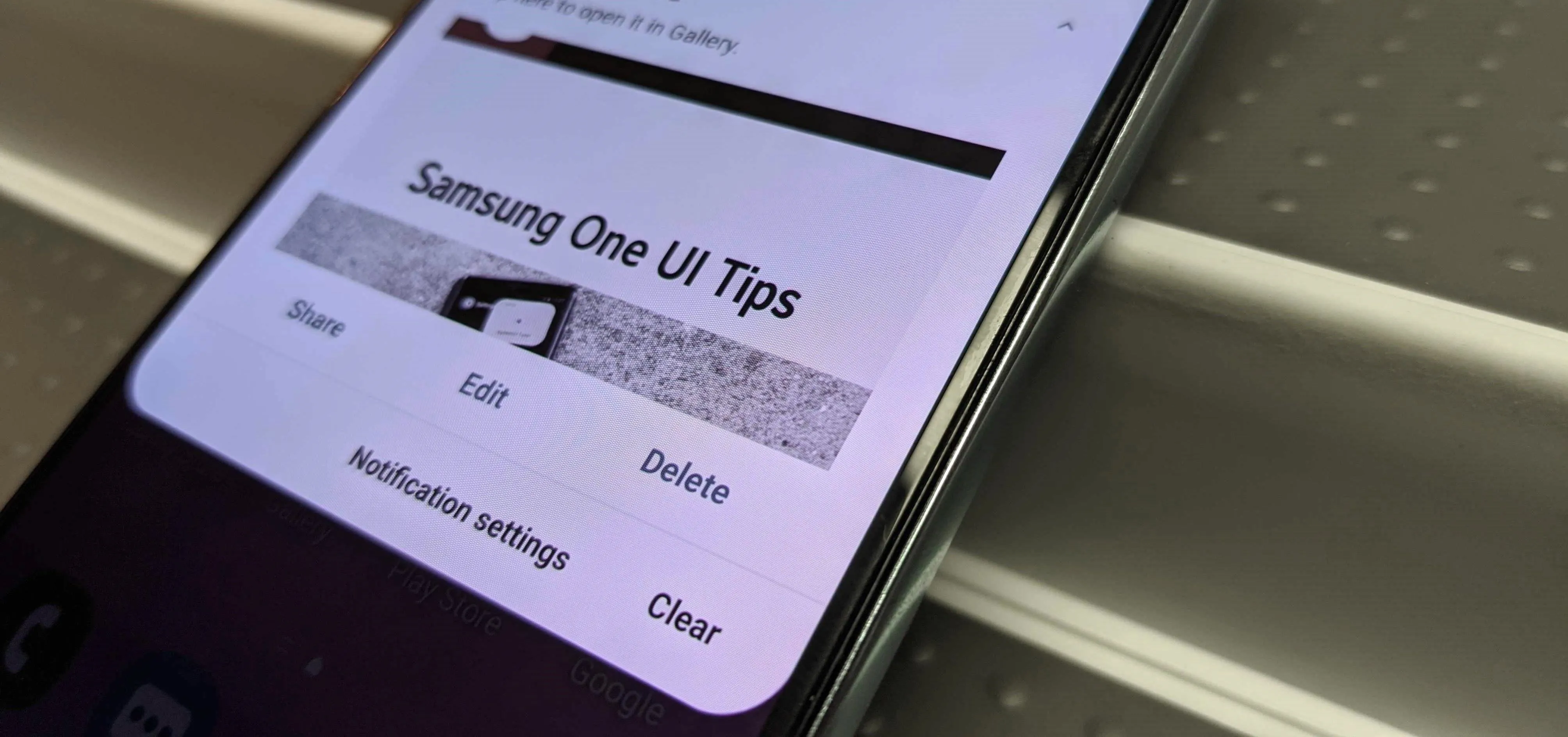 Samsung One UI Tips displayed on a smartphone screen.