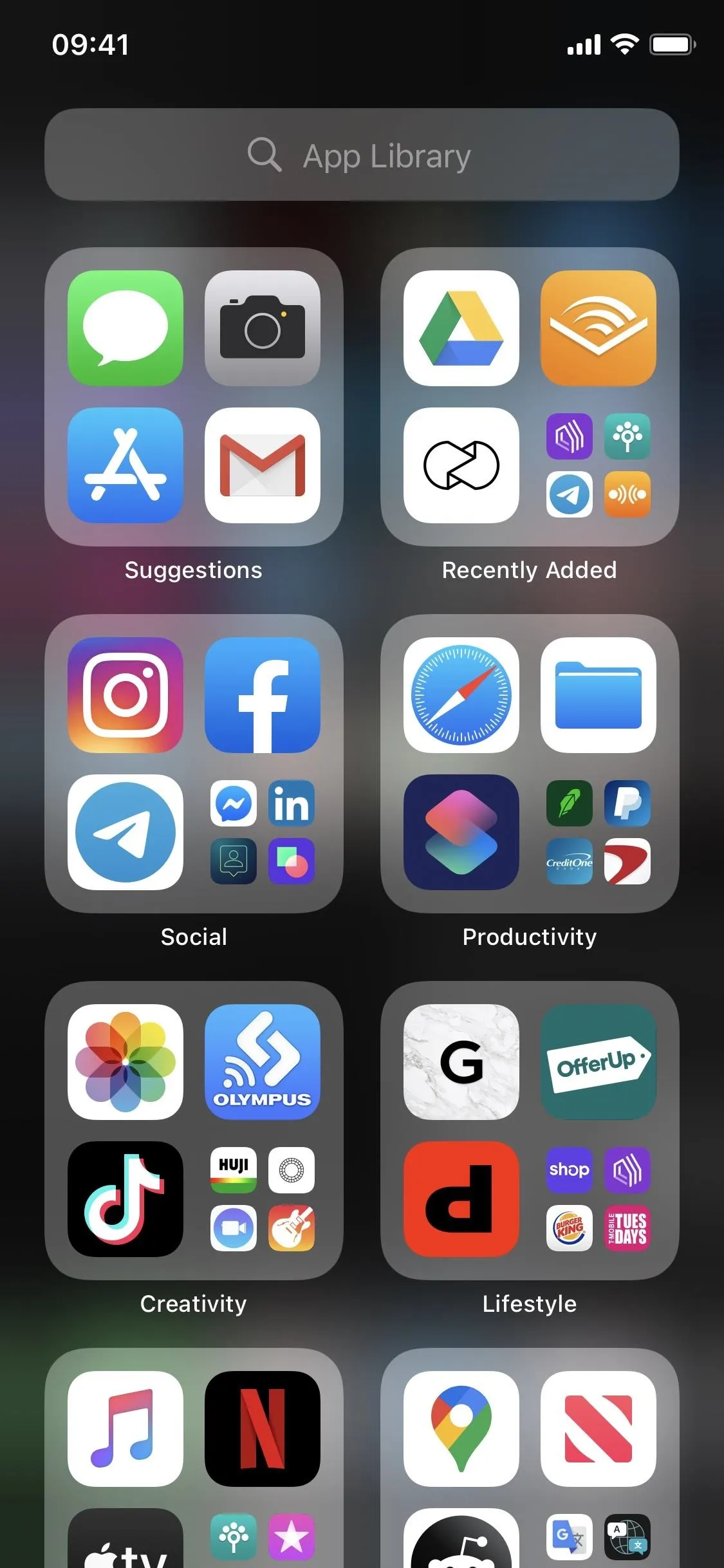 Screenshot of a smartphone home screen displaying various app icons, including social media, email, and productivity applications.