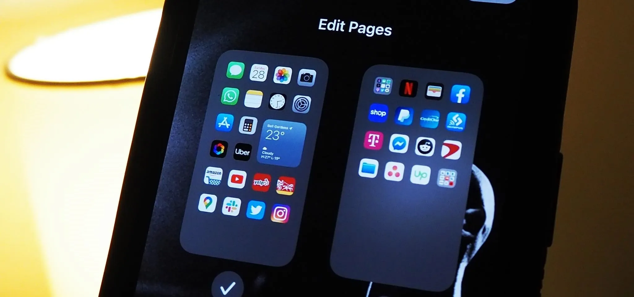 App folders displayed on a mobile device screen with an option to edit pages.