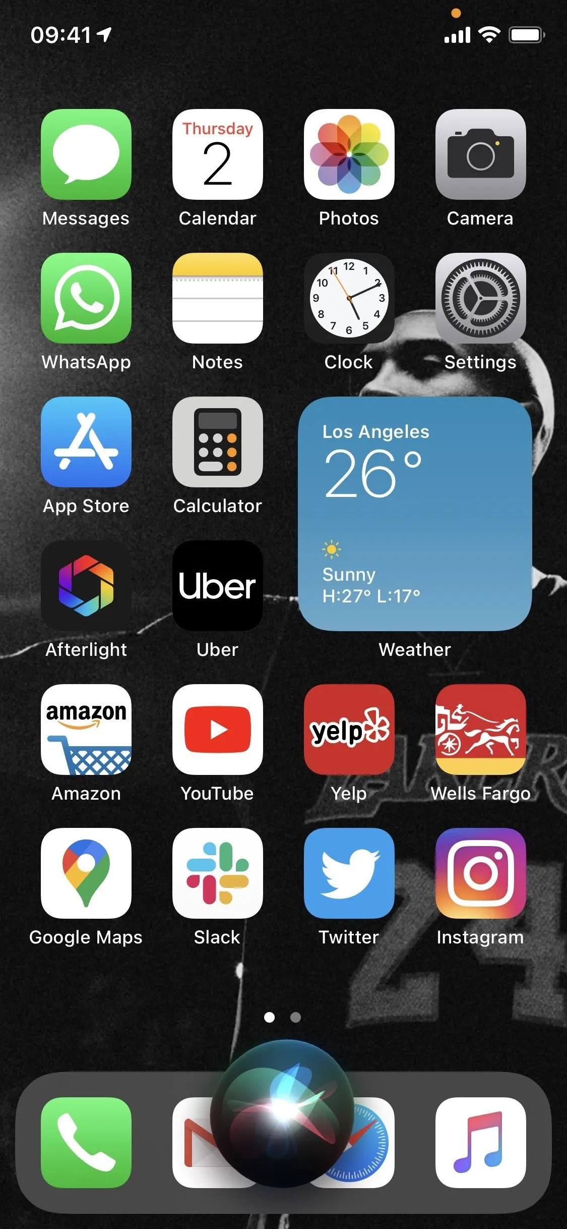 Image of a smartphone home screen displaying various app icons and a weather widget.