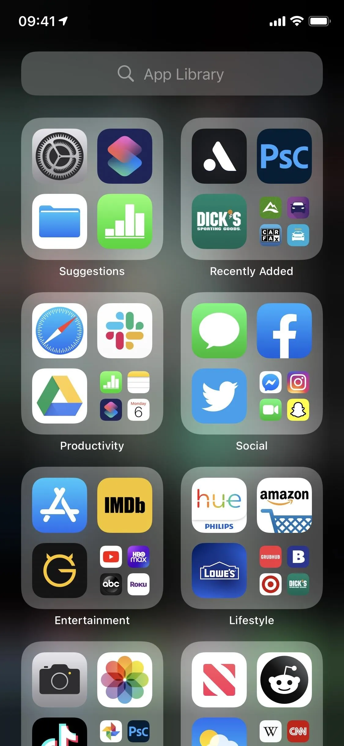 Smartphone screen displaying various app icons organized into folders.