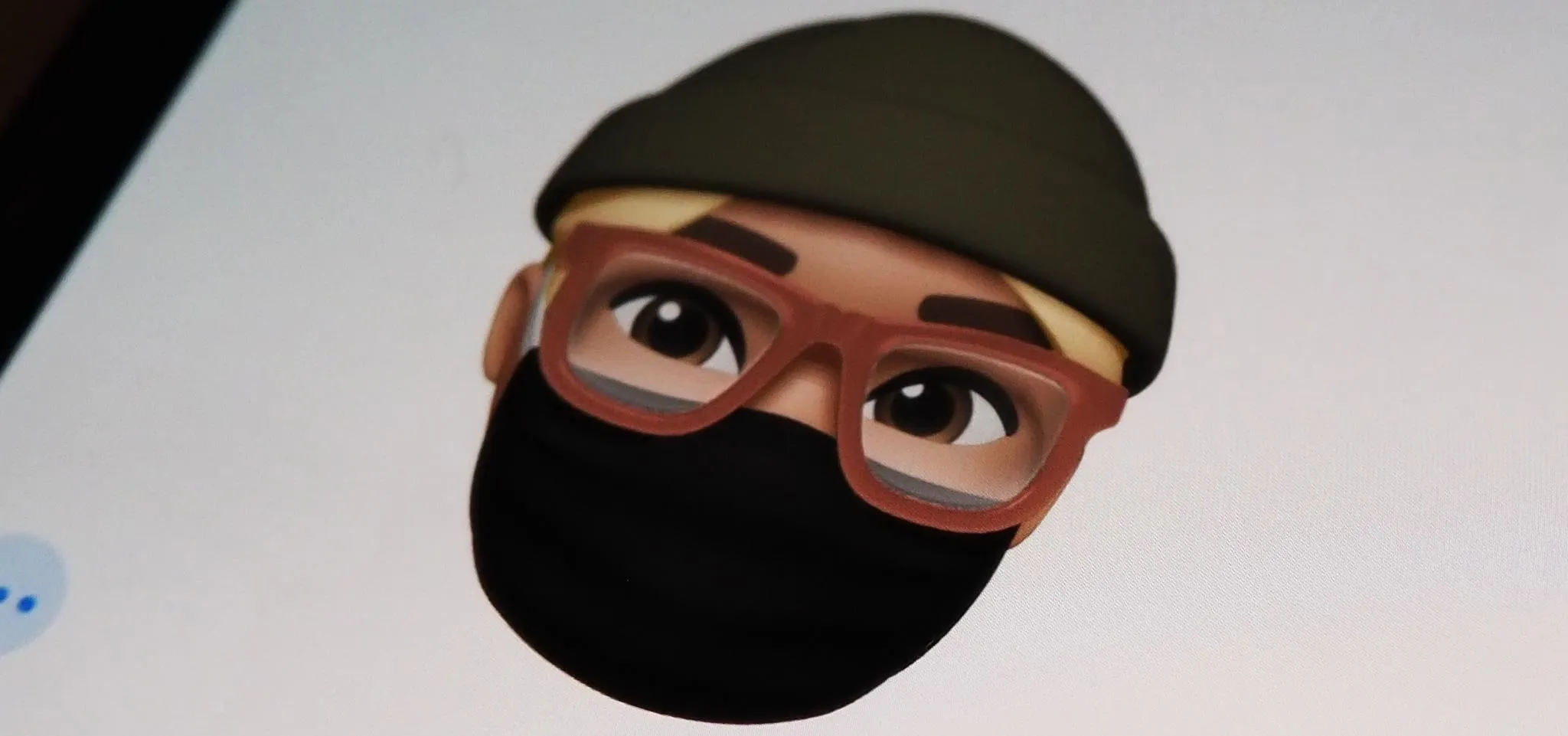 3D animated character wearing glasses, a beanie, and a black mask.