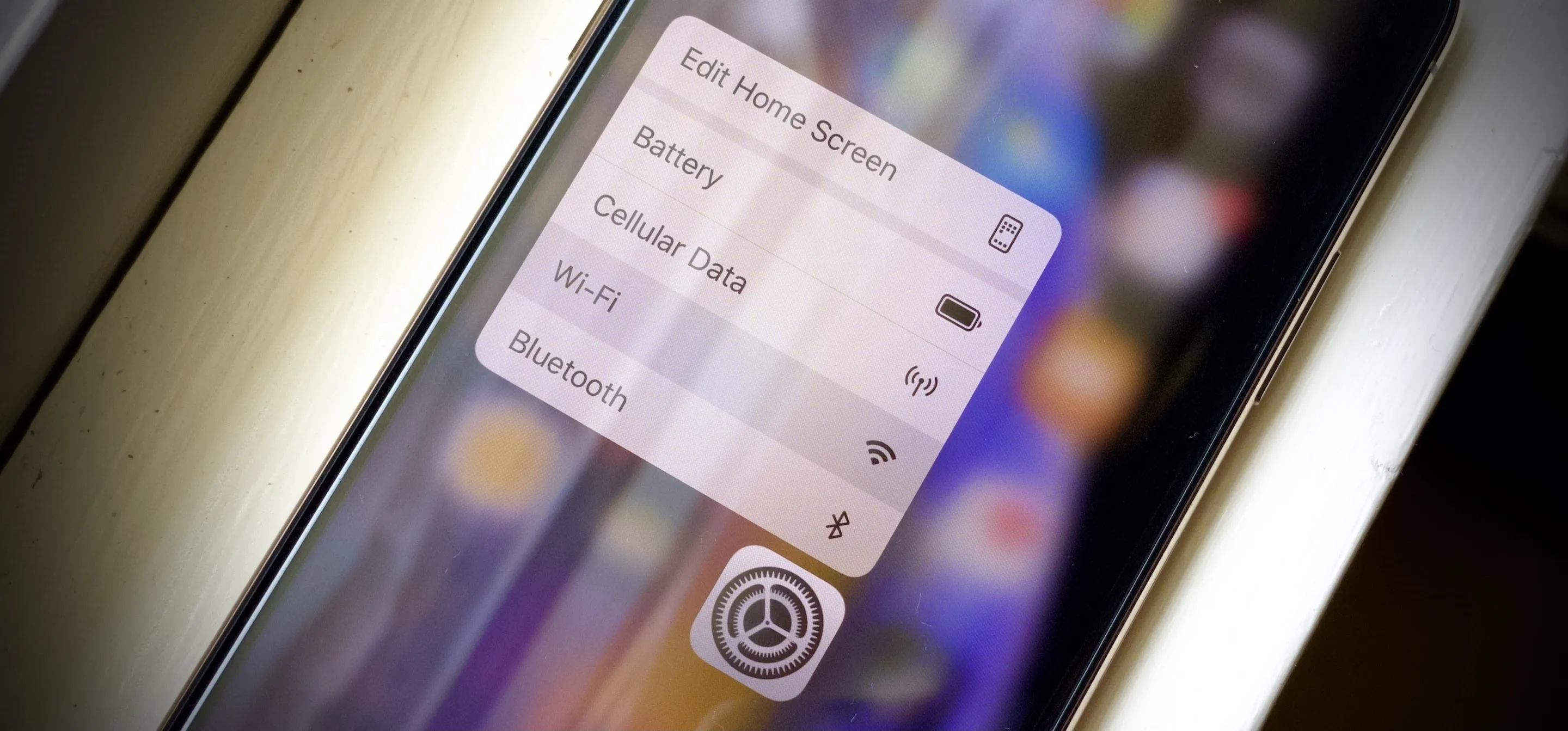 Smartphone screen displaying battery, cellular, and Bluetooth settings options.