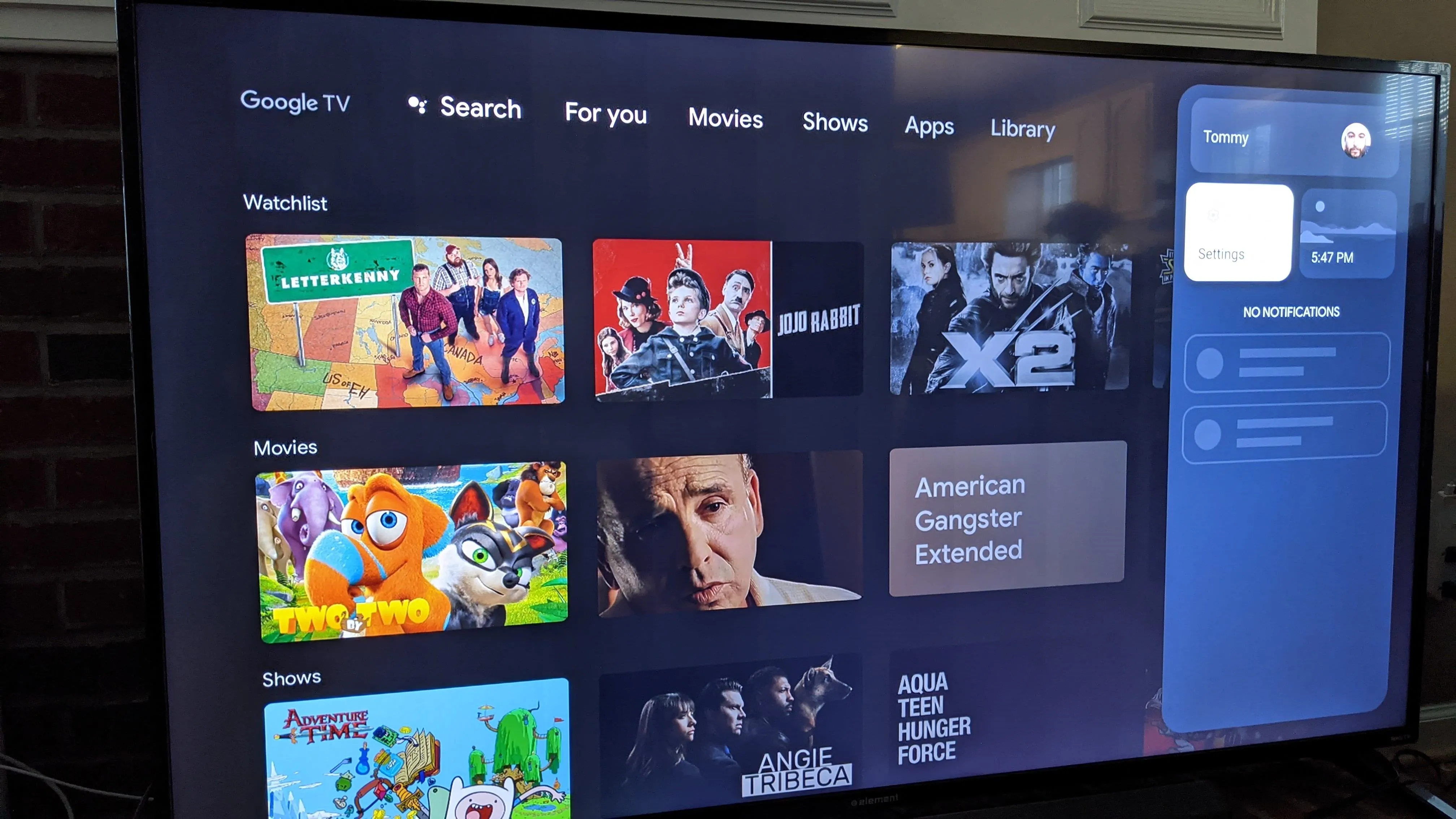 Smart TV interface displaying various movie and show options.