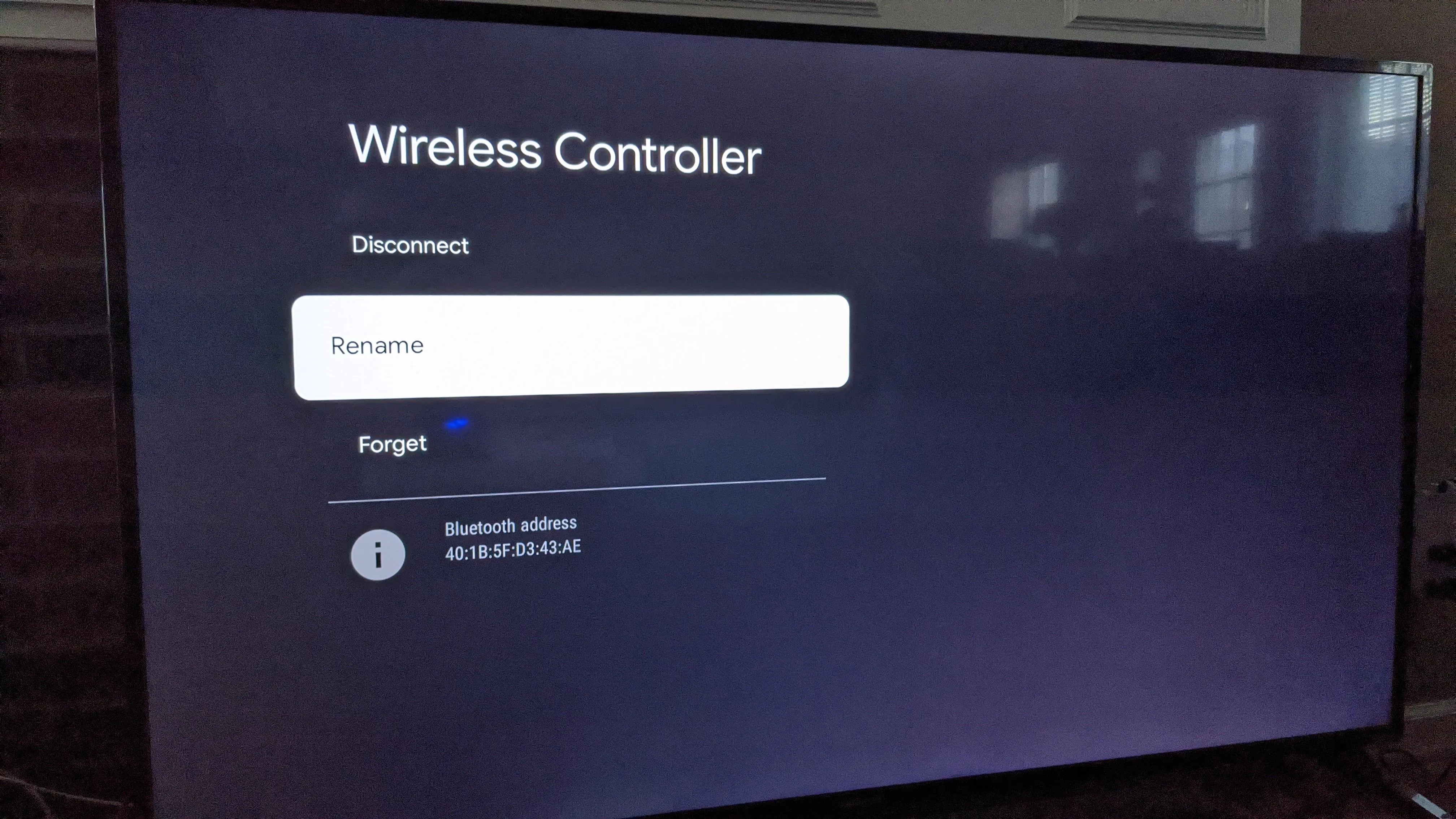 Wireless controller connection interface displaying options to disconnect and rename the device.