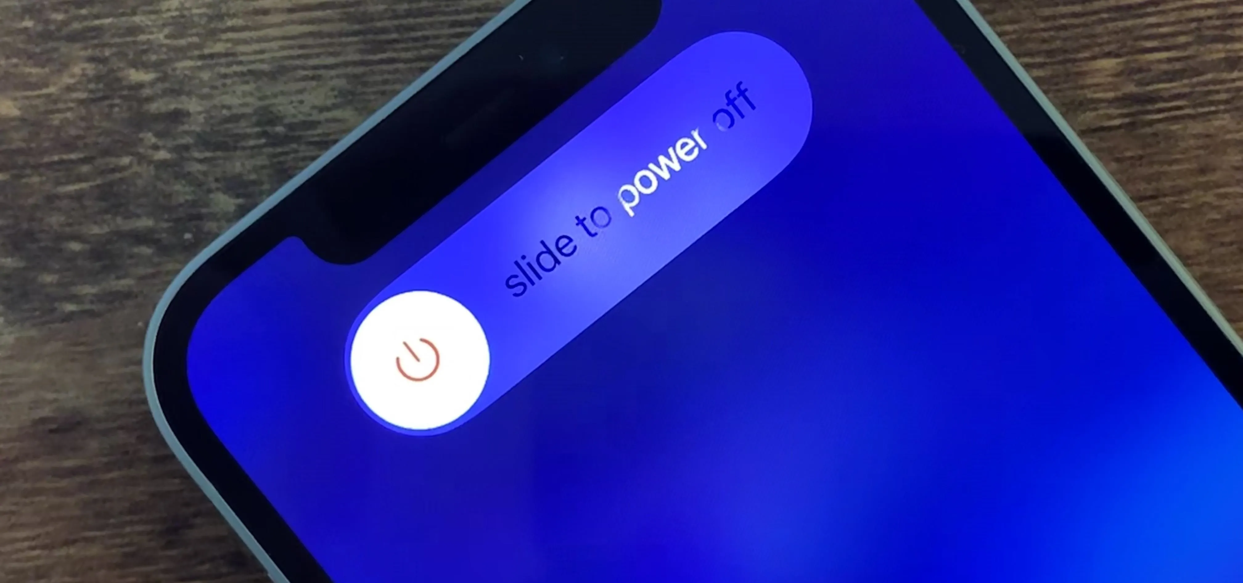 Power off slider on a smartphone screen.